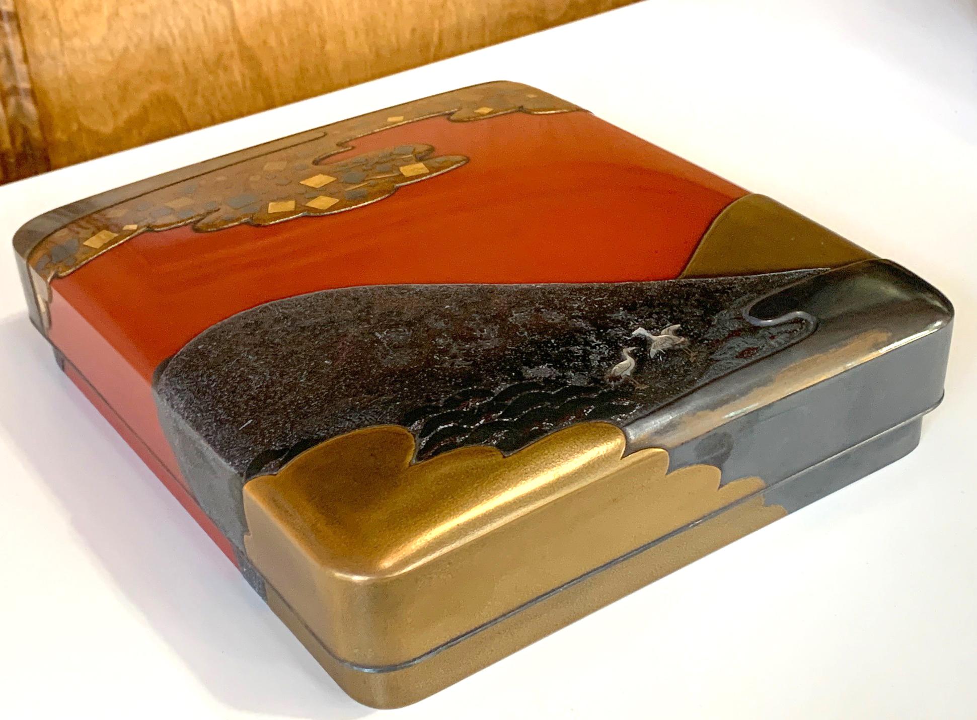 A striking and finely lacquered Suzuribako (writing box) with ink stone and bronze waterdrop from Japan circa late Meiji to early Taisho period (1900-1920s). Among a US collection purchased from a Christie's sale in 1997, the suzuribako has rounded