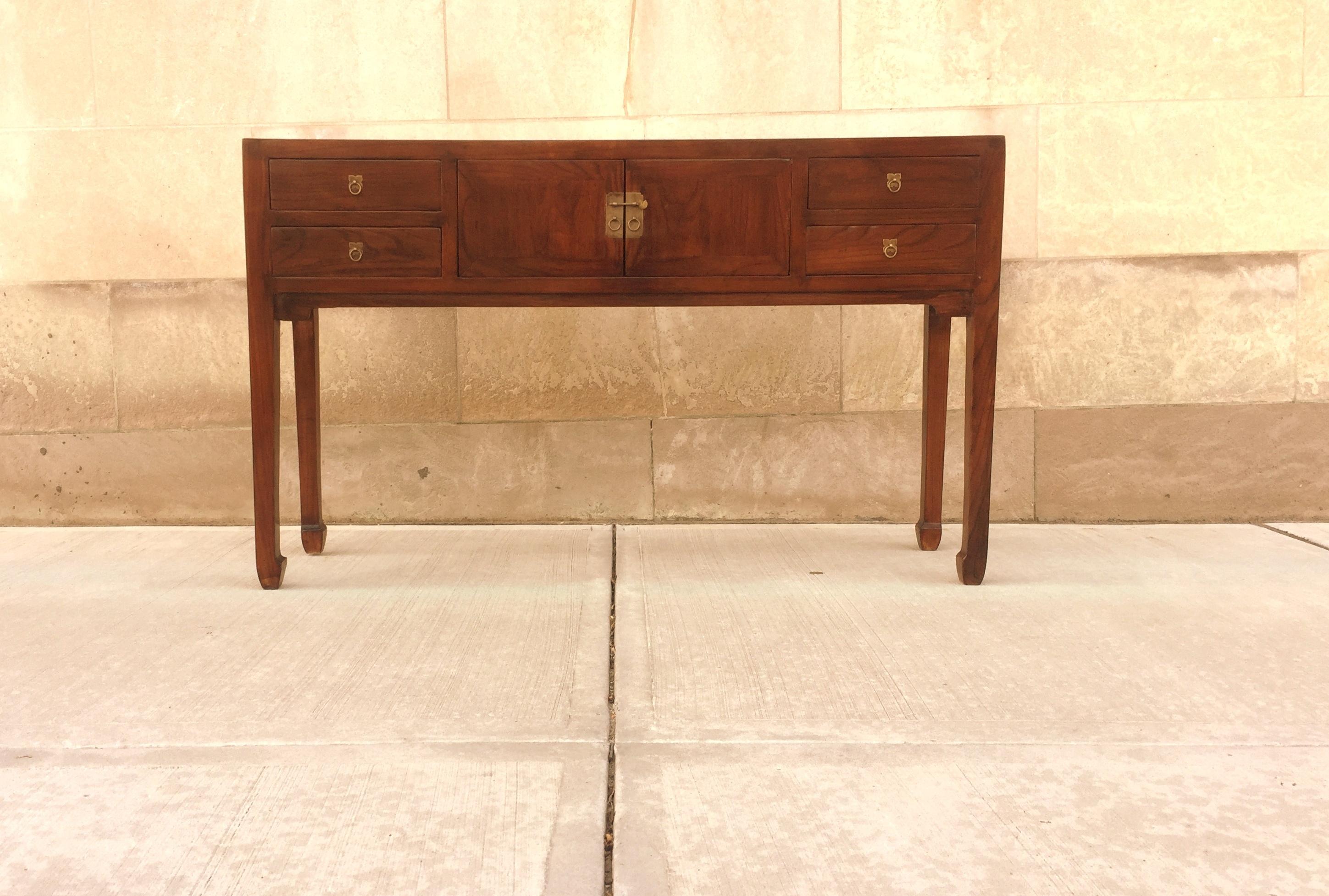Fine Jumu console table with four drawers and pair of doors. Very elegant and fine quality. Beautiful color and simple form. We carry fine quality furniture with elegant finished and has been appeared many times in 