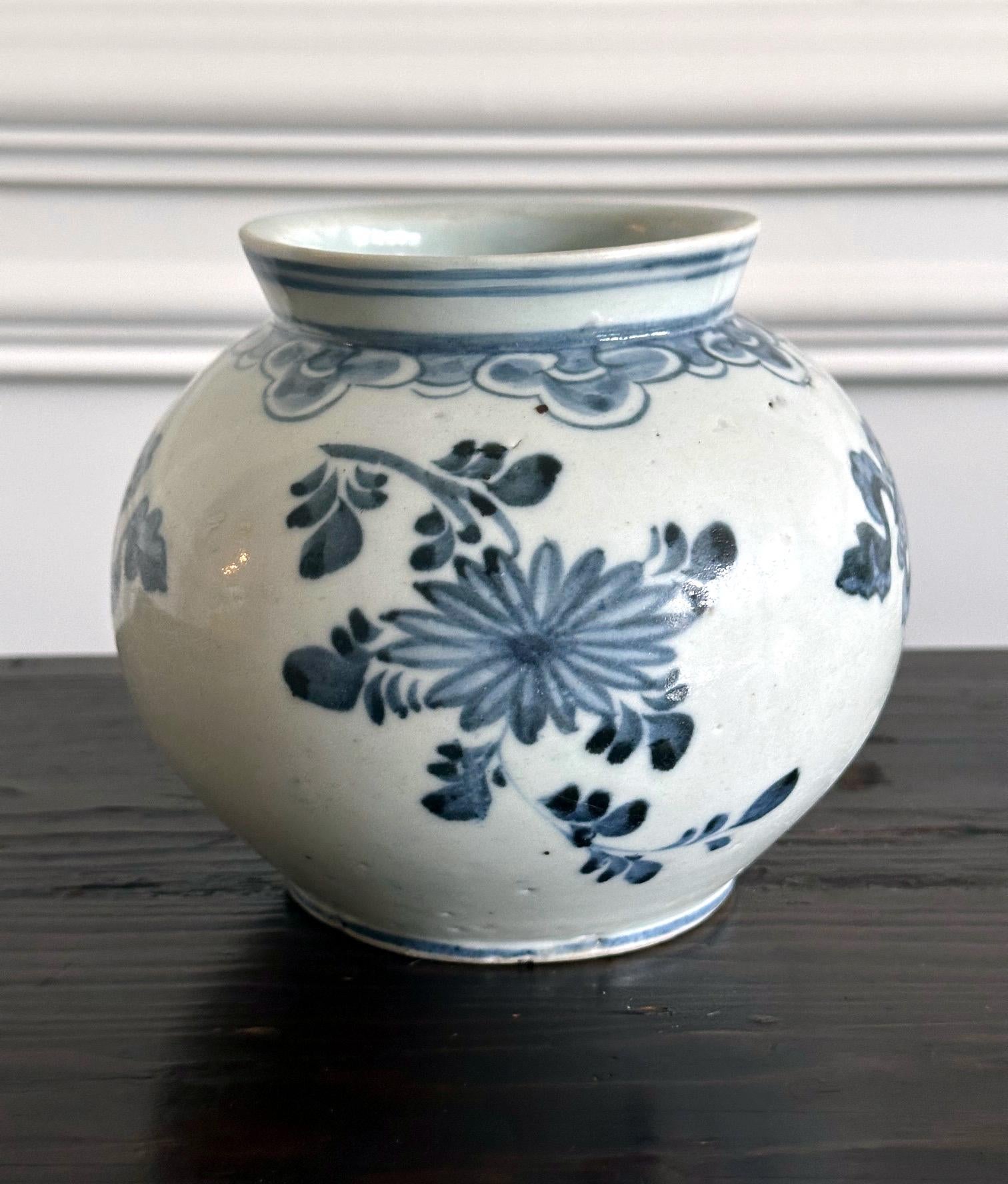 A fine Korean white porcelain jar with underglaze blue painting circa second half of 19th century, Joseon Dynasty. Considered associated with Punwon-ri kilns in Gwangju, these types of globular jar with large mouth on a short near-straight neck were