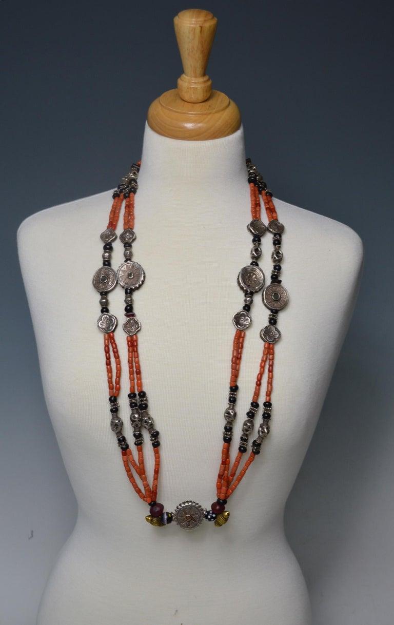 Beautiful old Pashtun silver and coral marriage necklace from Afghanistan
 
A long very finely made necklace of silver beads with finest quality antique red coral with ancient glass beads 

Period: 19th century 

Measures: Overall