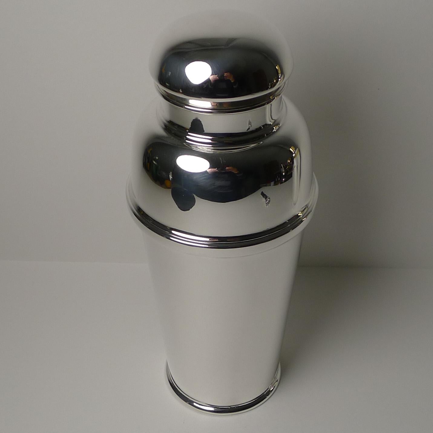 A most unusual and impressive cocktail shaker, just back from our silversmith's workshop where it has been professionally cleaned and polished, restored to it's former glory.

A two-piece shaker, the lid lifts off and reveals a fixed straining