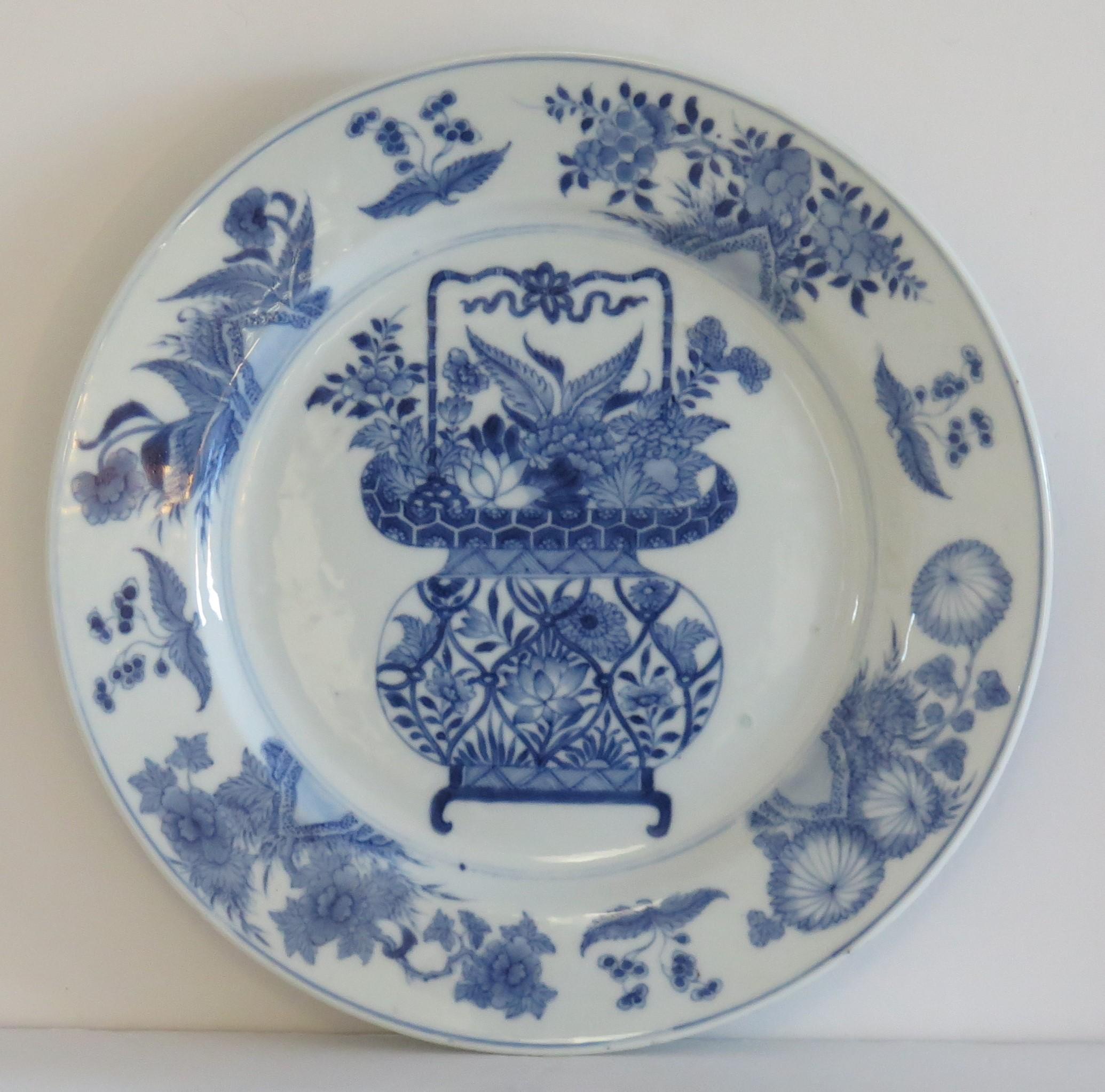 This is a beautifully hand-painted Chinese porcelain blue and white large plate from the Qing, Kangxi period, 1662-1722.

The plate is finely potted with a carefully cut base rim and a lovely rich glassy, very light blue glaze.

This is a large