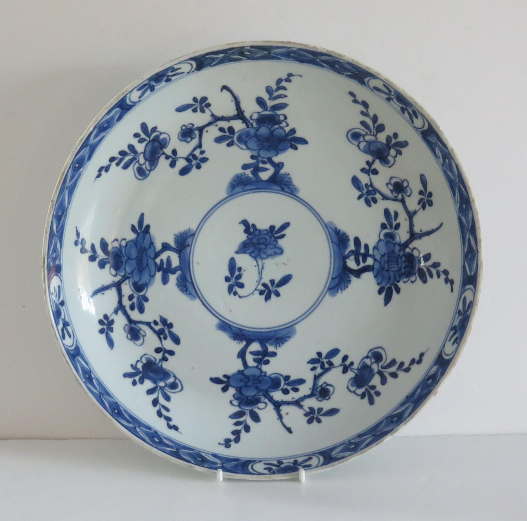 This is a beautifully hand painted Chinese porcelain blue and white large plate from the Qing, Kangxi period, 1662-1722.

This is a large deep plate measuring 11~1/8 inches ( about 282 mm) diameter, which makes an impressive display. The plate is