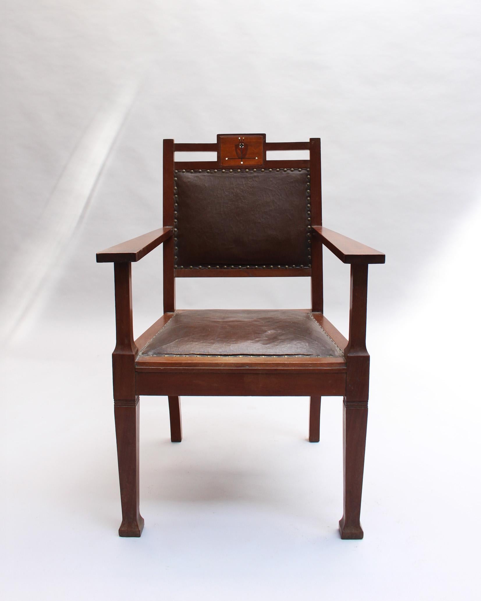 A fine Vienna Secession armchair with wooden and mother of pearl marquetry details.

