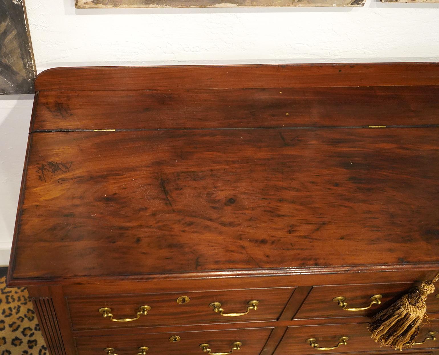 Wonderfully figured mahogany 18th Ct. English mule chest. Lid opens for storage and bottom three drawers work. Top 6 drawers are faux. Beautiful pieces of Mahogany used in making this.