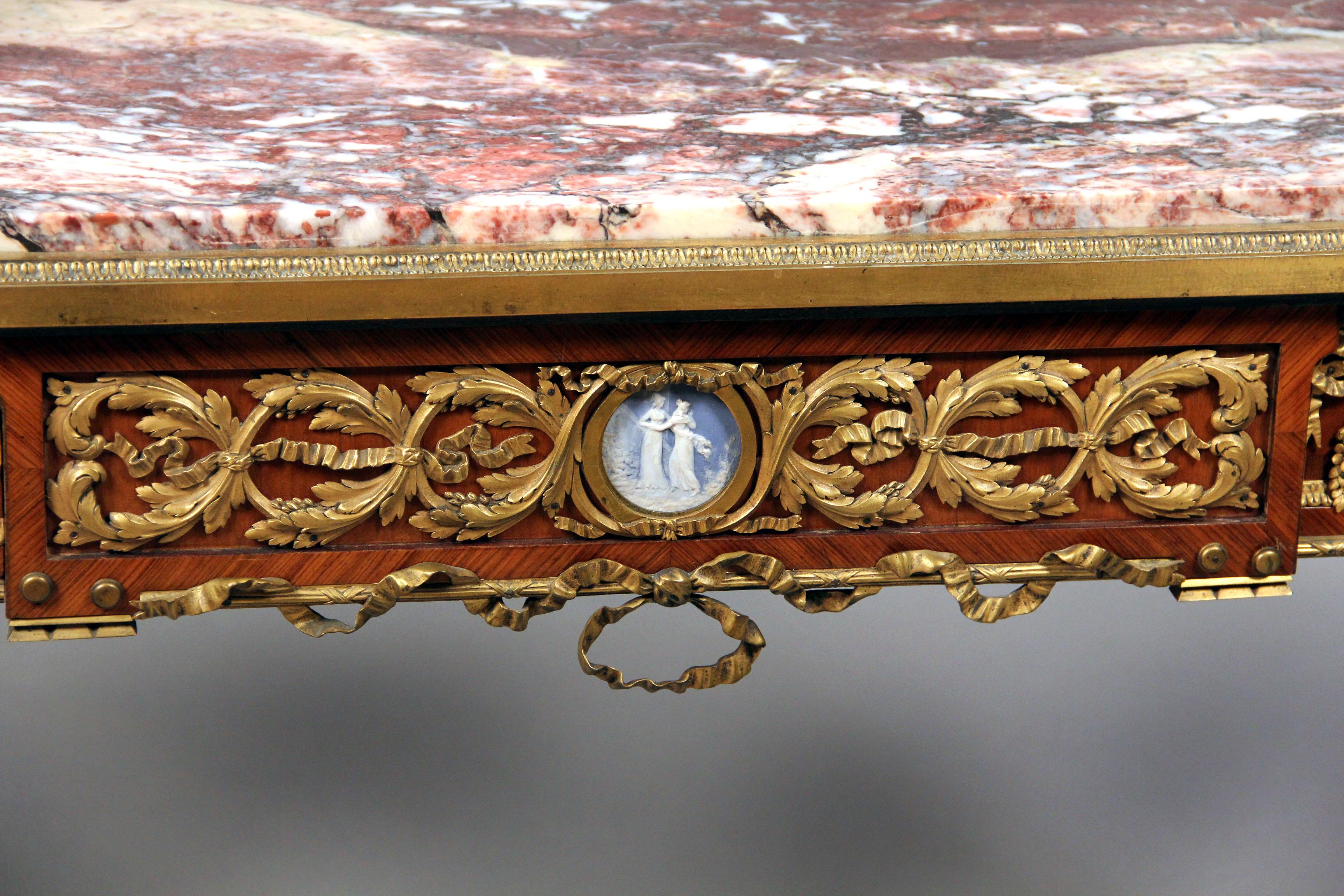 An exceptionally fine late 19th century Louis XVI style gilt bronze-mounted mahogany centre table

By Joseph Zwiener

In the manner of the 18th century model by Riesener. The rectangular marble top above a frieze drawer, raised on square