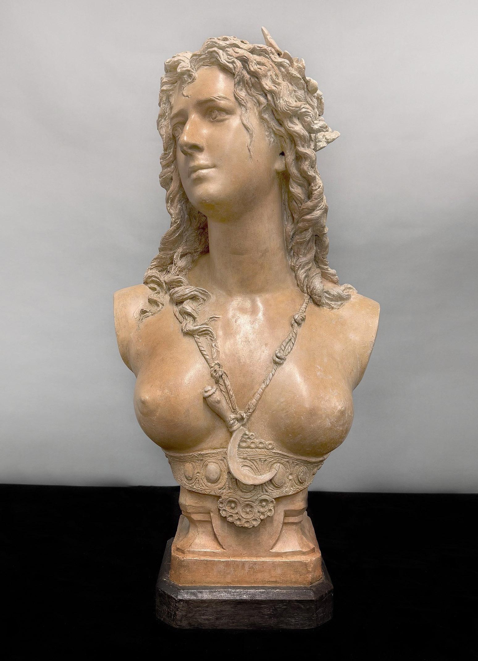 A Fine Late 19th Century Terracotta Bust of a Young Maiden by Carrier Belleuse

Albert-Ernest Carrier-Belleuse

A lovely scantily clad beautiful woman wearing a necklace, her long waivy hair under a laurel leaf crown, standing on a painted