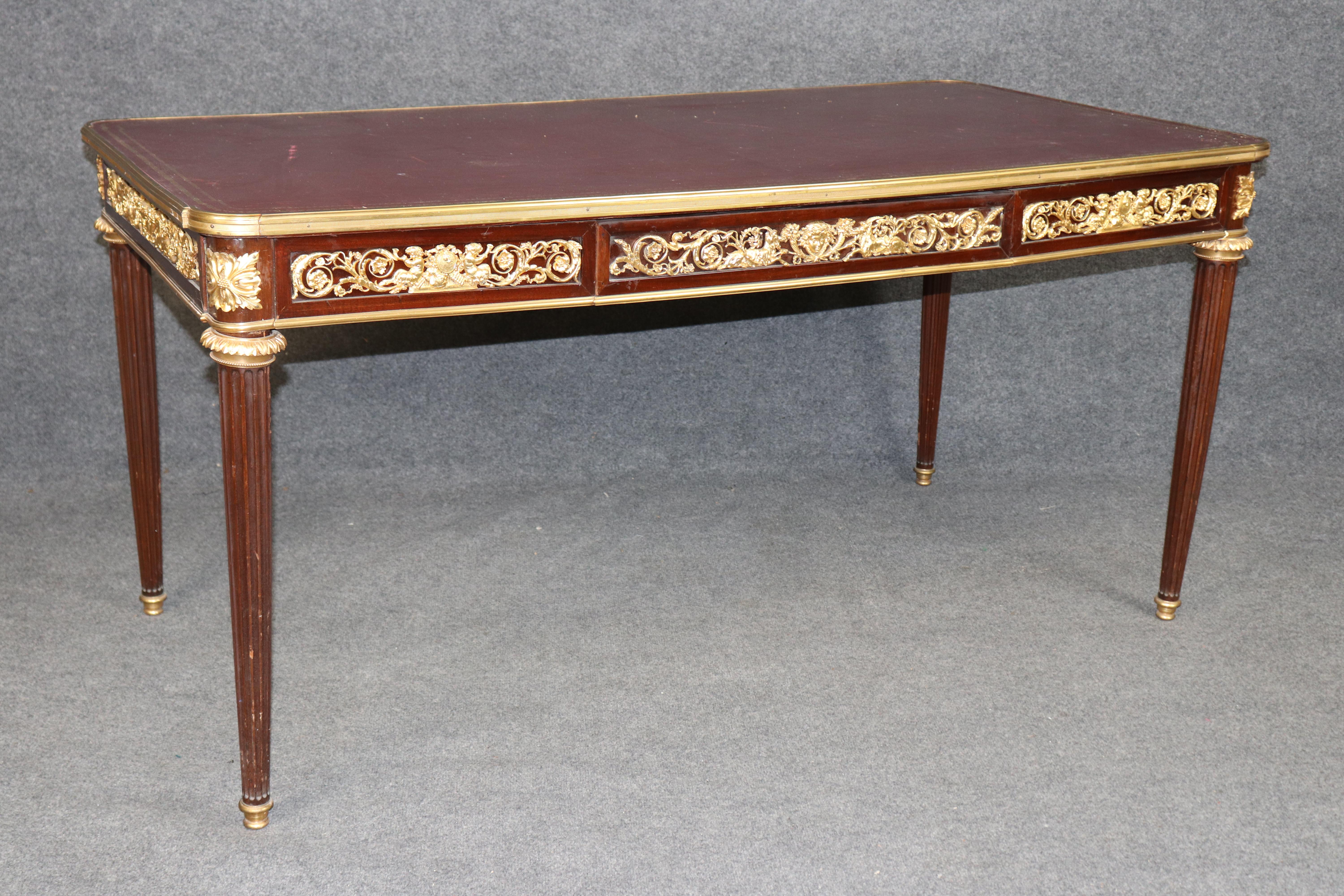 **French Gilt Doré Bureau Plat Desk by Maison Millet – Exquisite 1890–1920s Ormolu Masterpiece**

This exceptional **French gilt doré and mahogany bureau plat** is attributed to the renowned Parisian ébéniste **Maison Millet**, one of the most