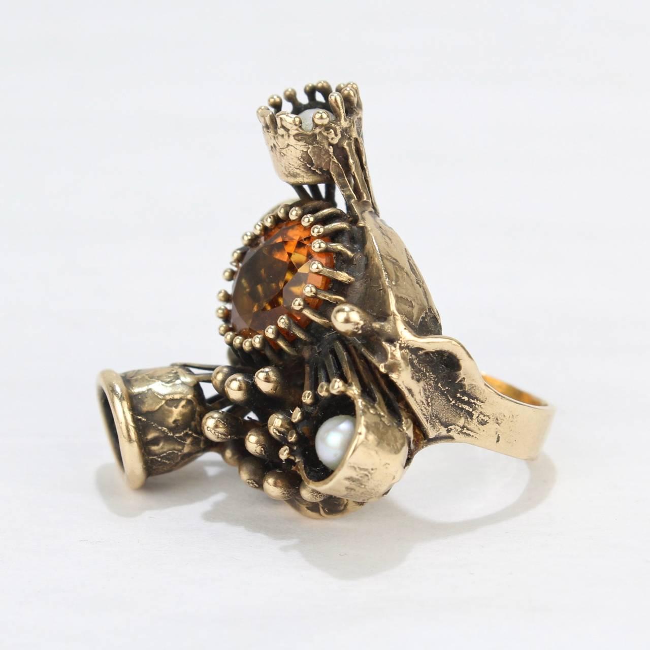 A futuristic Steam Punk 14-karat ring with pearls and a citrine by Lee Peck.

Simply a compelling ring with subtle depth and outlandish style!

Lee Barnes Peck was a distinguished Professor of Metal & Jewelry at Northern Illinois for decades. His