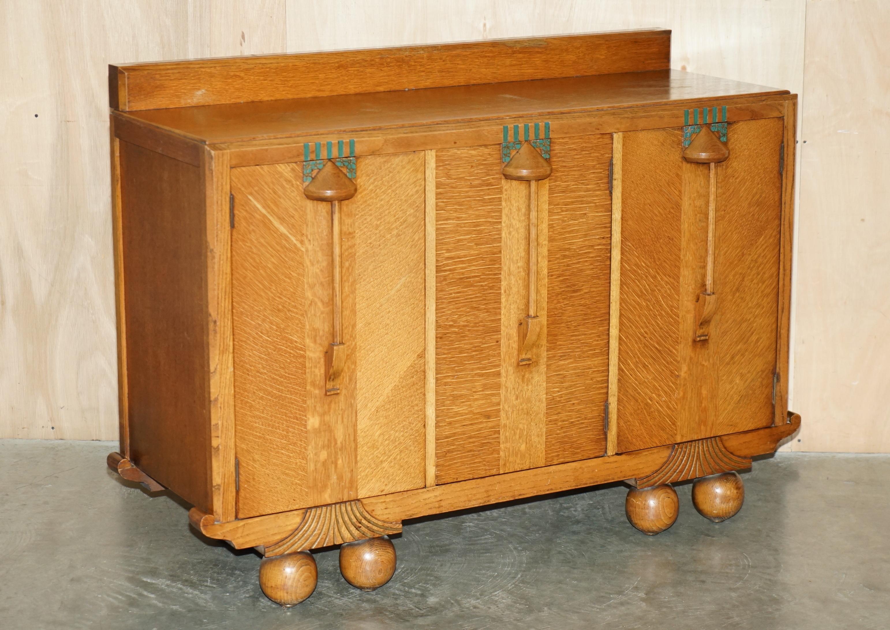 Royal House Antiques

Royal House Antiques is delighted to offer for sale this lovely circa 1920’s Art Deco Liberty's London style Cotswold sideboard with built in campaign bank of drawers which is part of a suite 

Please note the delivery fee