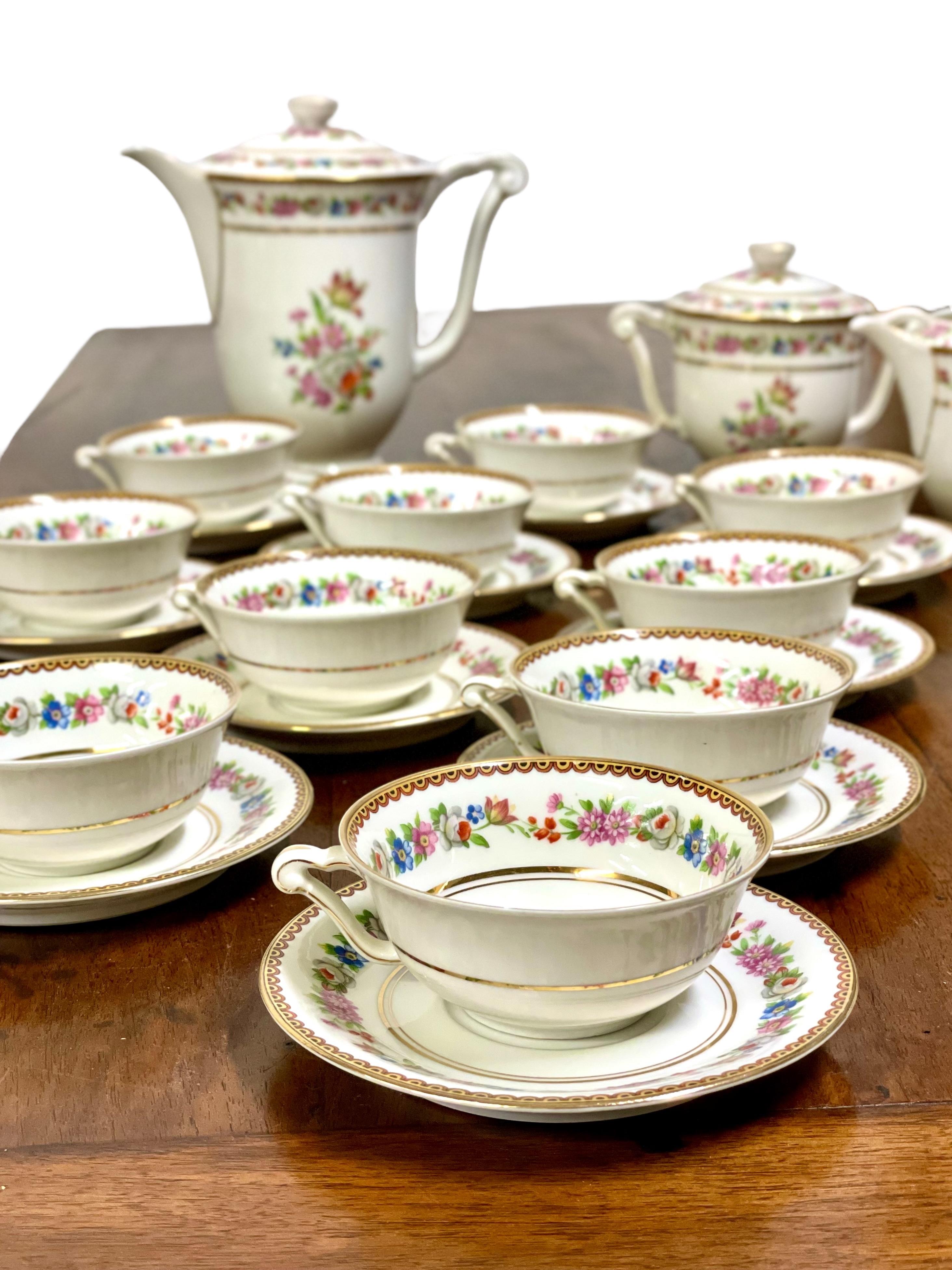 An extremely elegant 17-piece tea service made by the celebrated porcelain manufacturer Raynaud & Cie of Limoges, whose products have been adding sophistication and elegance to the most refined dining tables for more than a century. Dating from