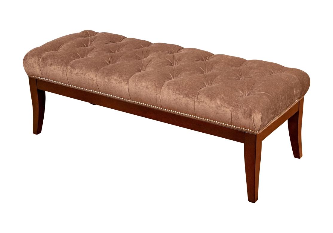A very well made and stylish Bench from Charles Stewart. A long designer bench in a dark stained wood frame with square tapering splayed legs. Upholstered seat in a button tufted brown faux suede fabric with nail head trim.

L. 54