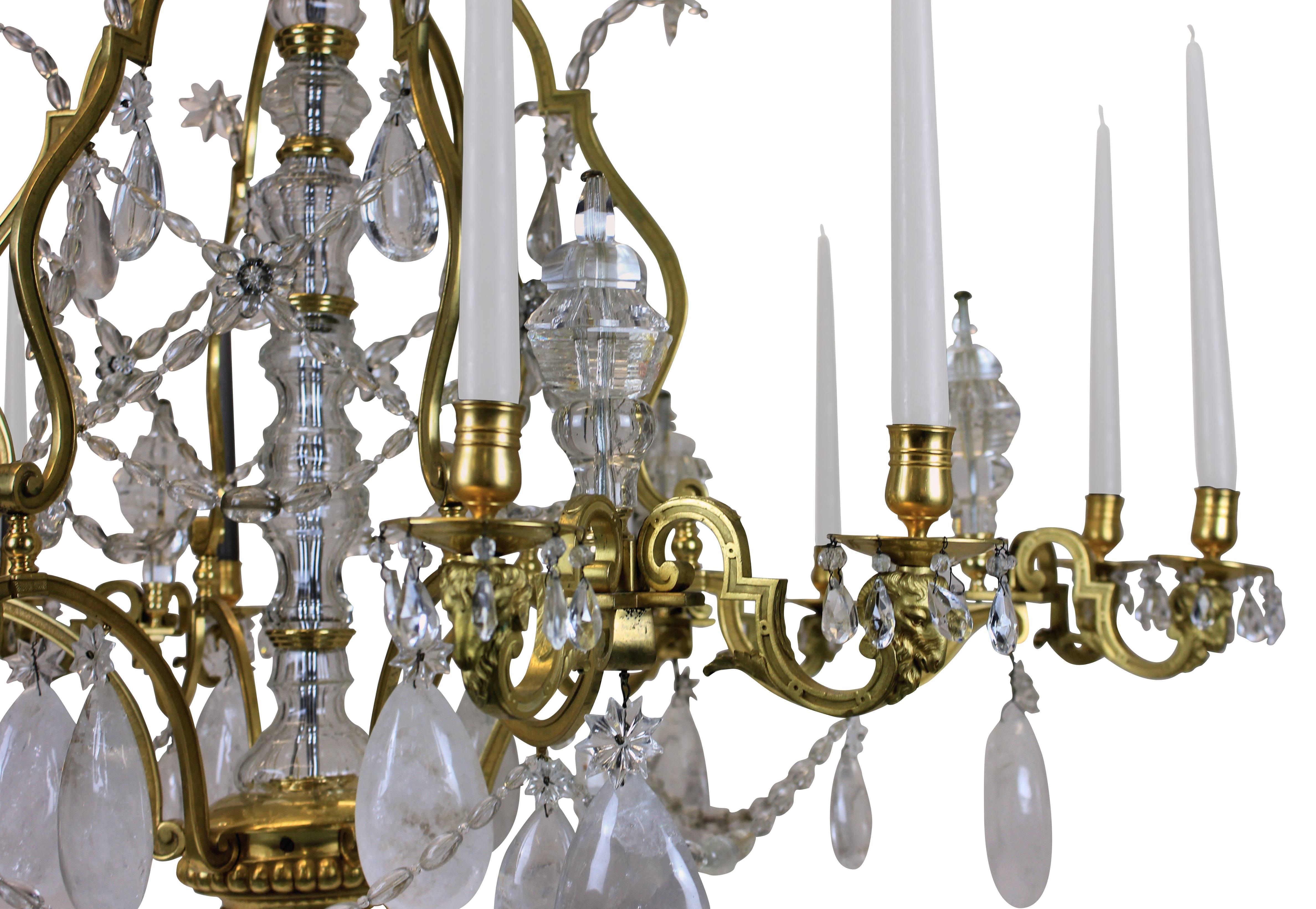 This Louis XIV chandelier is monumental in scale and is of the highest quality of mercury gilded bronze and hung with rock crystal. Of superb proportions and detail. With ram's head decoration to each arm, of which there are twelve in total, with