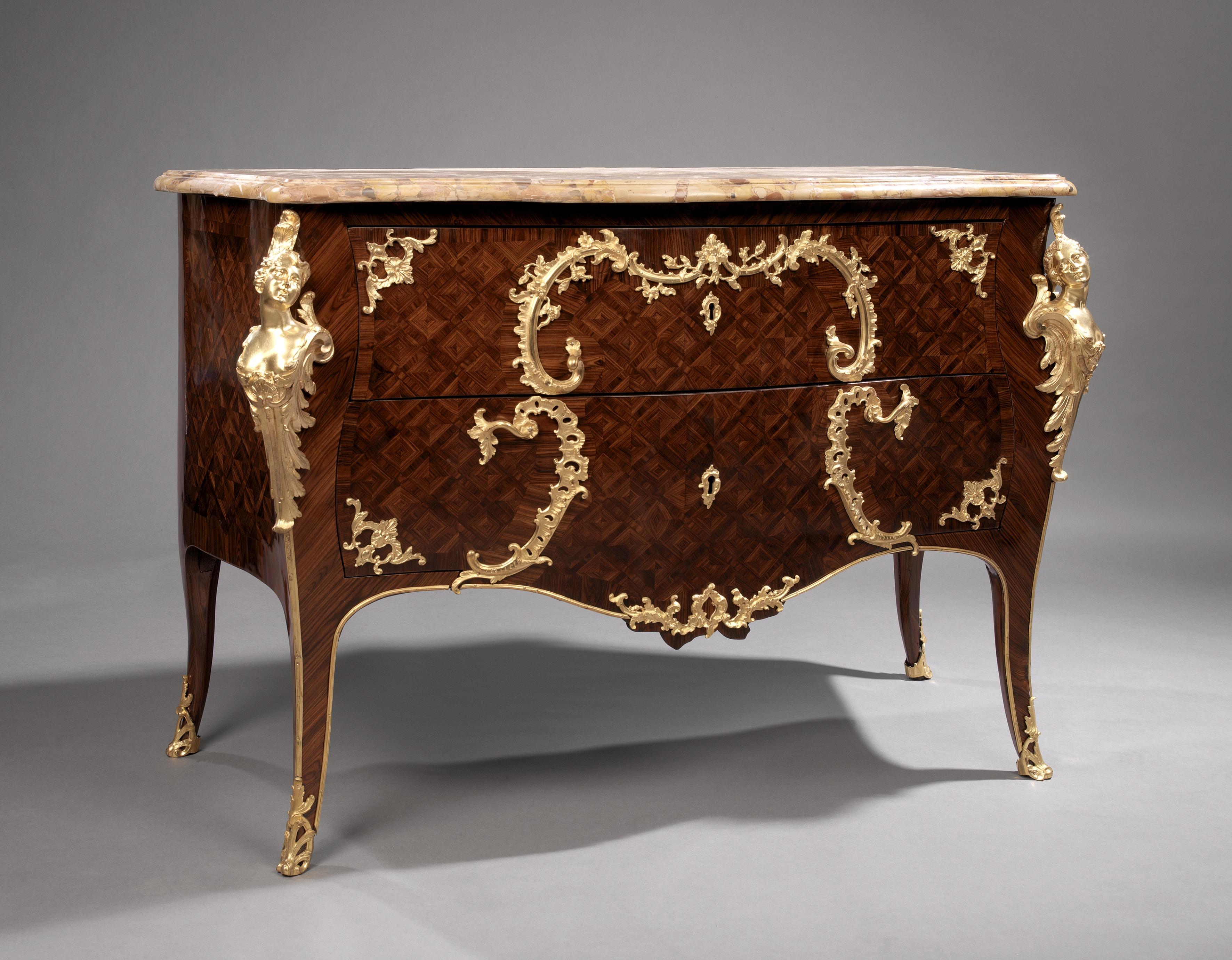 A fine Louis XV style gilt-bronze mounted parquetry commode.

French, circa 1880.

This fine commode has a Breche d’Alep marble top above two shaped drawers with the handles forming a cartouche of scrolling gilt-bronze acanthus. The corners of