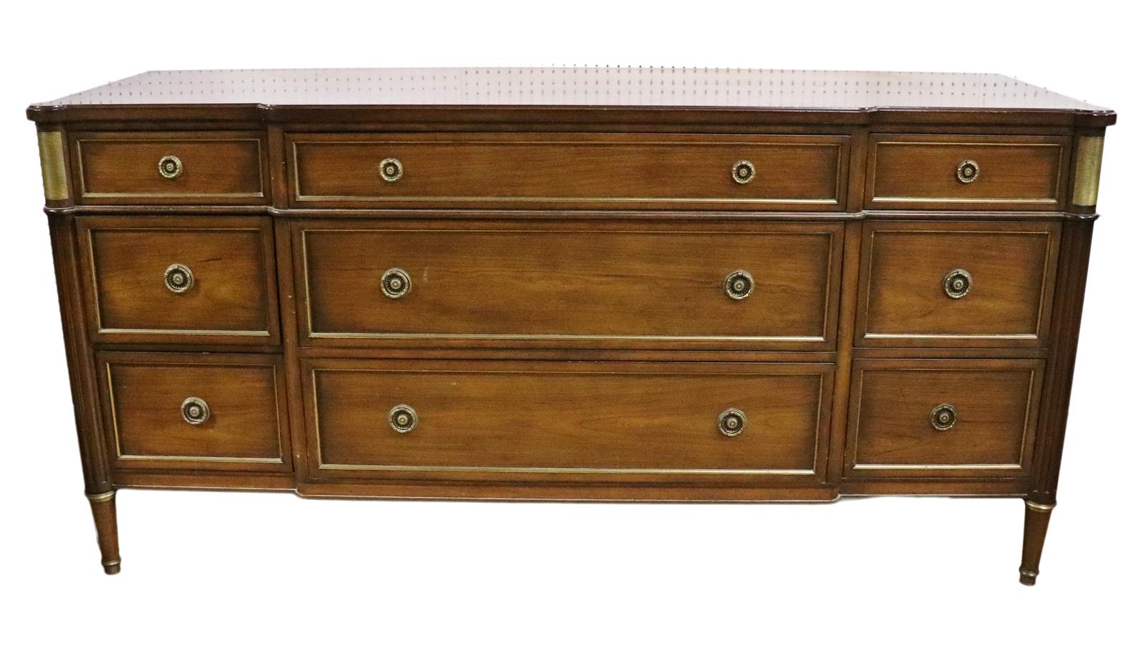 Attributed to Maison Jansen. Brass accents. Brass hardware. 9 Dovetail drawers. Measures: 35