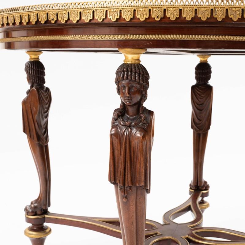 Fine Louis XVI style Ormolu and mahogany Guéridon, after a model by Bernard Molitor
Fitted with a white marble top within a pierced lappet decorated ormolu border, raised on classical female caryatid monopodia, joined by a pierced stretcher, raised