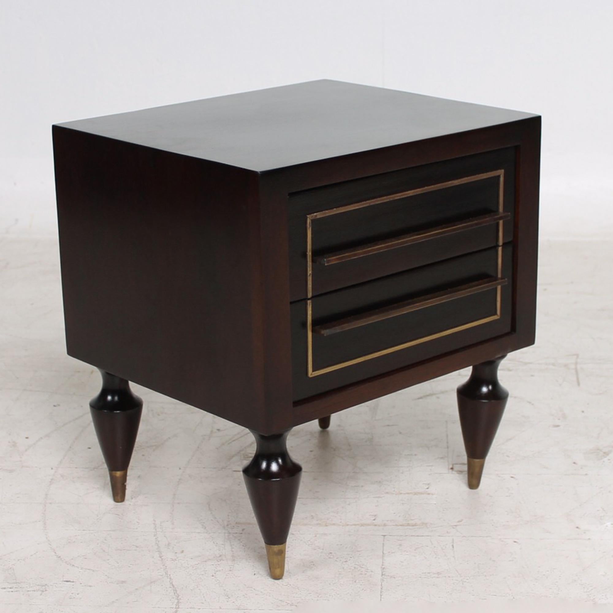 Wonderful display of fine Mexican Modernism with this pair of mahogany and brass nightstands. 
Made in Mexico circa 1950s
Attributed to Eugenio Escudero. Unmarked no signature or label present.
Nightstands supported by 'to die for' sculptural