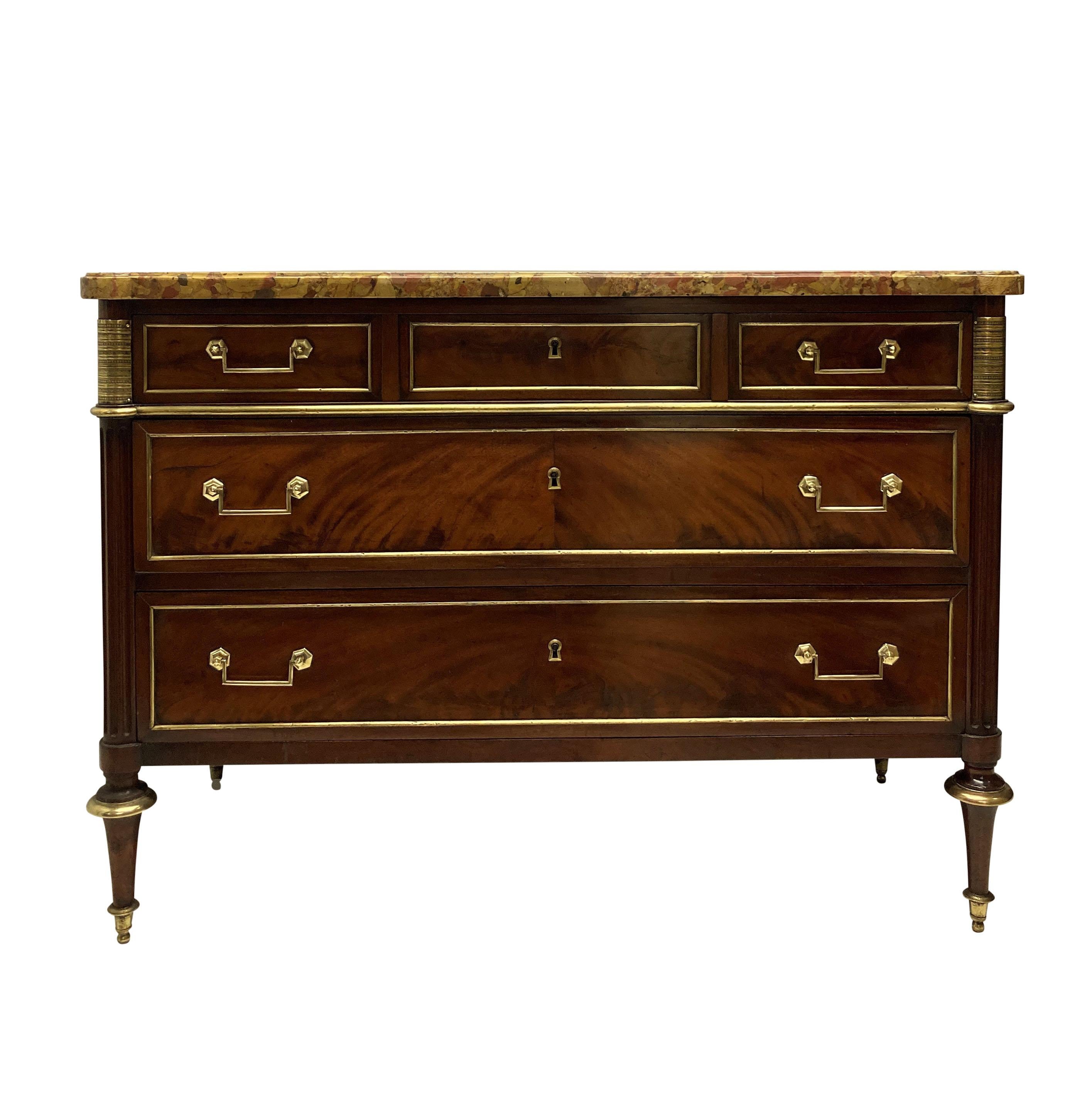 A fine French mahogany three draw Directoire commode, with gilt bronze mounts and detailing, with a breche d'alep marble top.