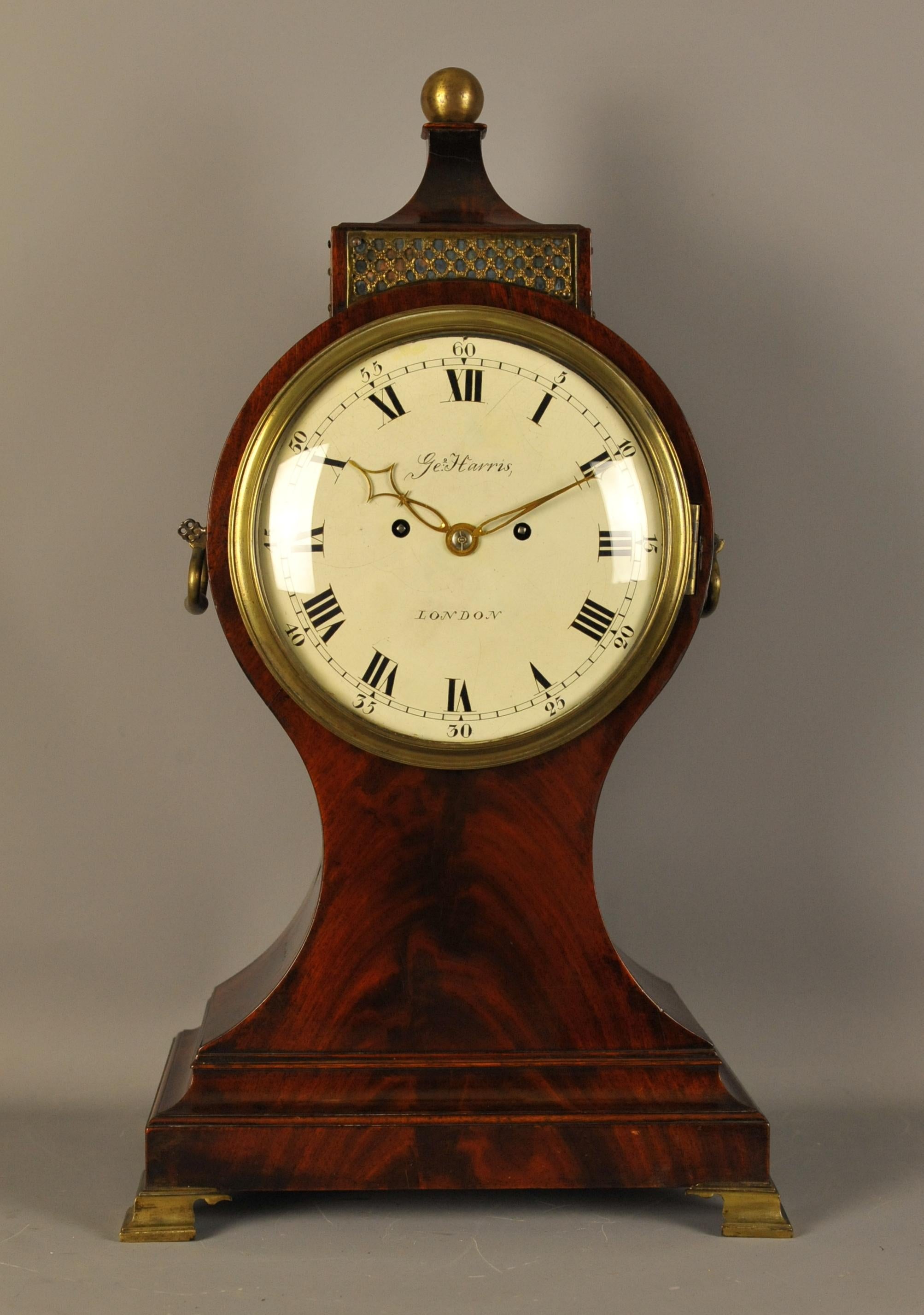 This is a fine and impressive English balloon clock of the very finest quality made, circa 1810 which is in the most wonderful original color. The 8 inch painted dial is signed George Harris London who was probably the retailer.
The substantial