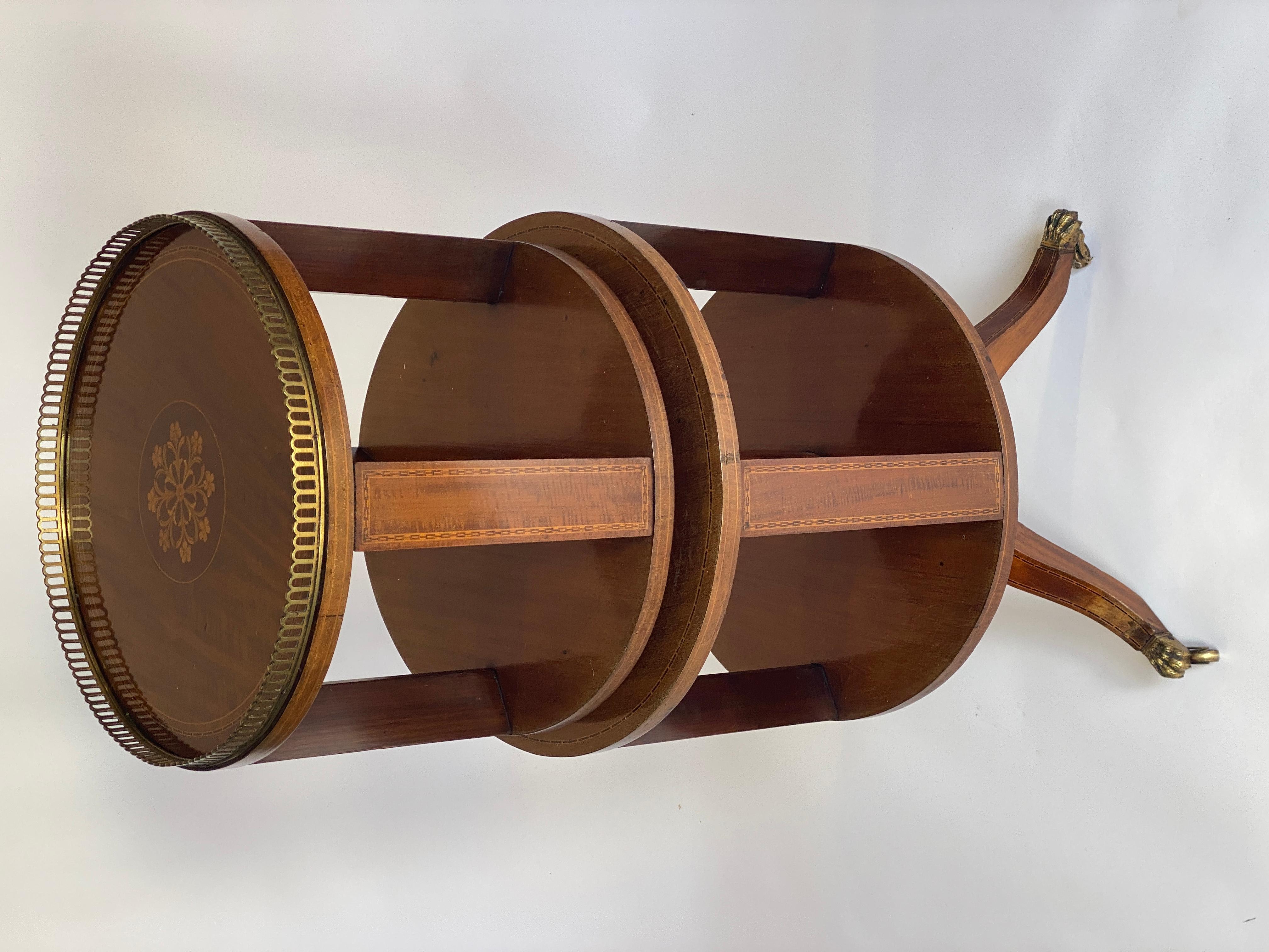 Fine Mahogany inlaid double Revolving Bookcase circa 1880s
Circular top with fine floral centre inlay
Boxwood line & chequer banded inlay, 
Brass gallery surround.
2 revolving circular sections,
Boxwood line inlay on outside edges on tops,
2nd tier