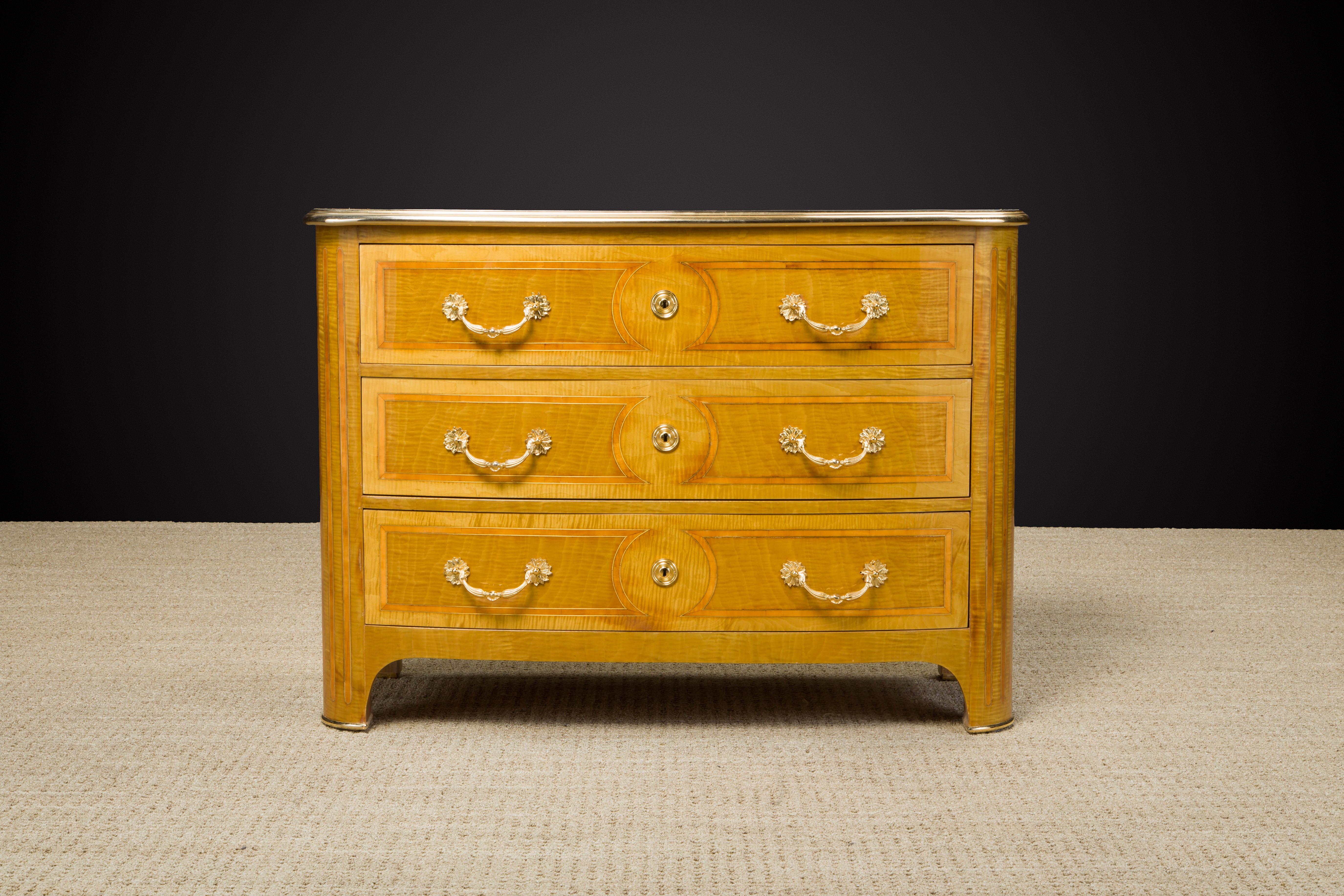 A beautiful fine Maison Jansen commode (France, c. 1960s) with exotic marquetry woods, brass inlay and brass trim, a similar example documented in the book 'Jansen Furniture' by James Archer Abbot.

We provided this commode with a new French