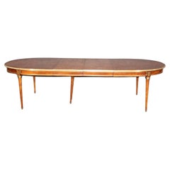 Fine Manner Jansen Burled Walnut Bronze and Brass Trimmed Oval Dining Table 
