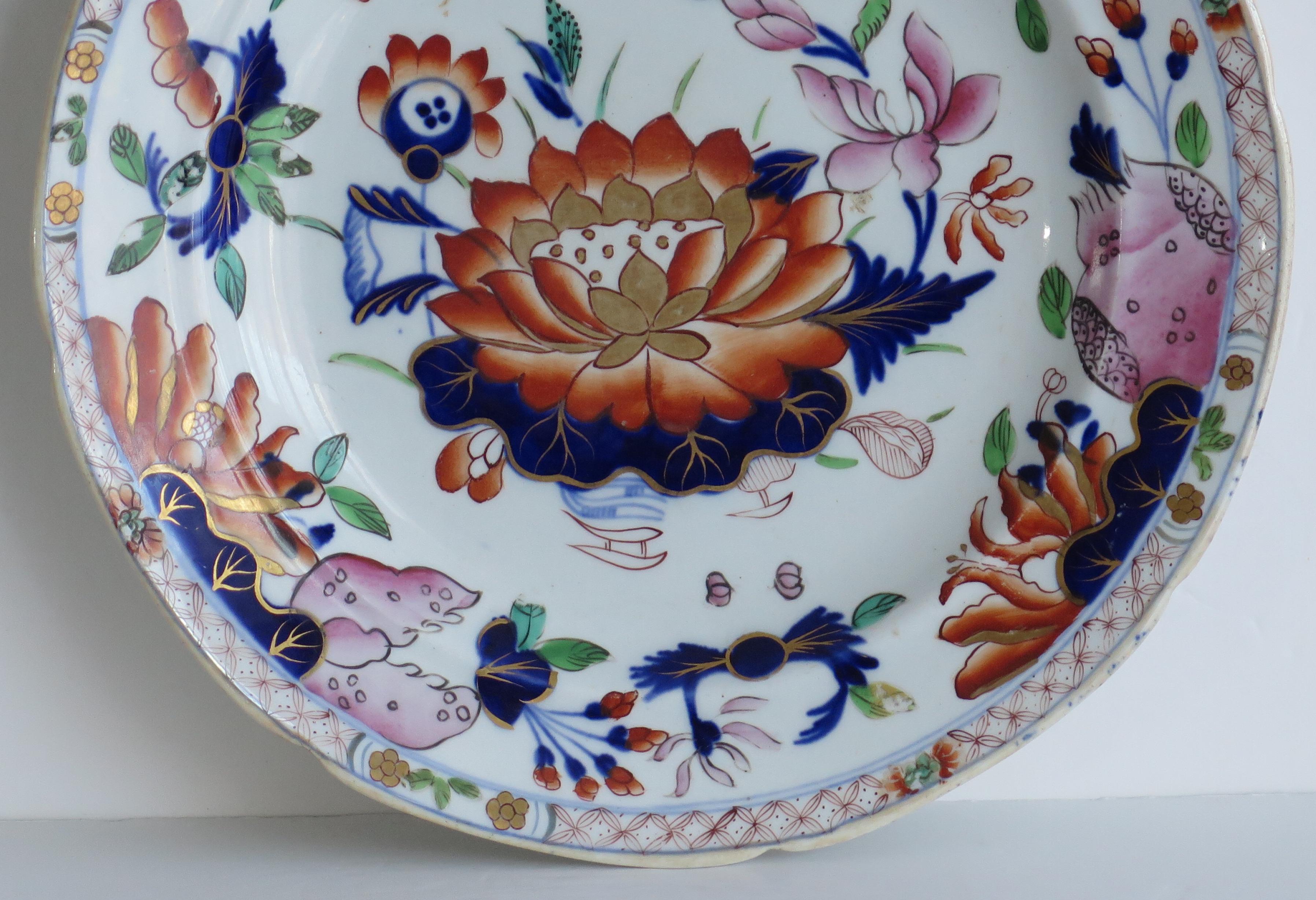 This is a very good Mason's Ironstone pottery dinner plate in the very decorative Water Lily pattern, produced by the Mason's factory at Lane Delph, Staffordshire, England, circa 1835.

The plate is circular with an indented rim.

It is well