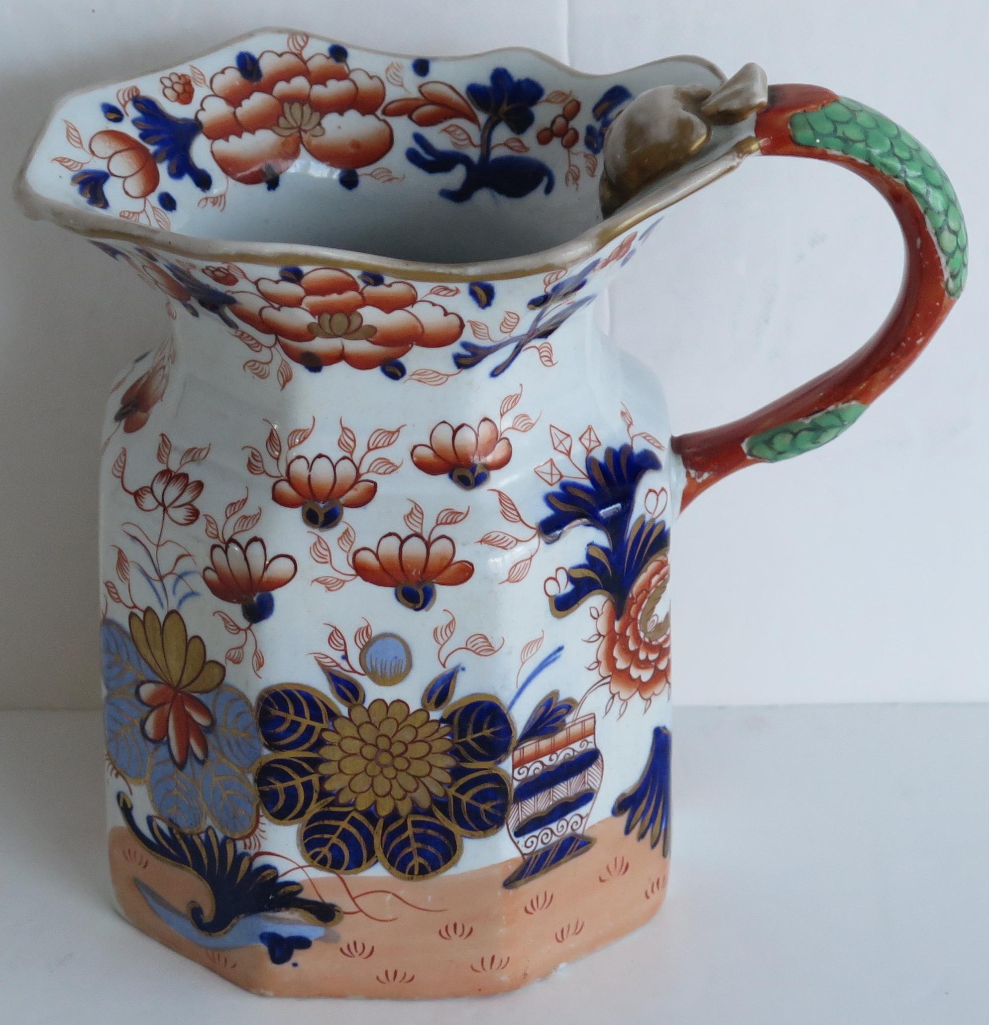 This is a very good Mason's ironstone jug or pitcher hand painted in the very decorative basket Japan gilded pattern, produced by the Mason's factory at Lane Delph, Staffordshire, England, circa 1835.

The jug has the Fenton shape with a dragon