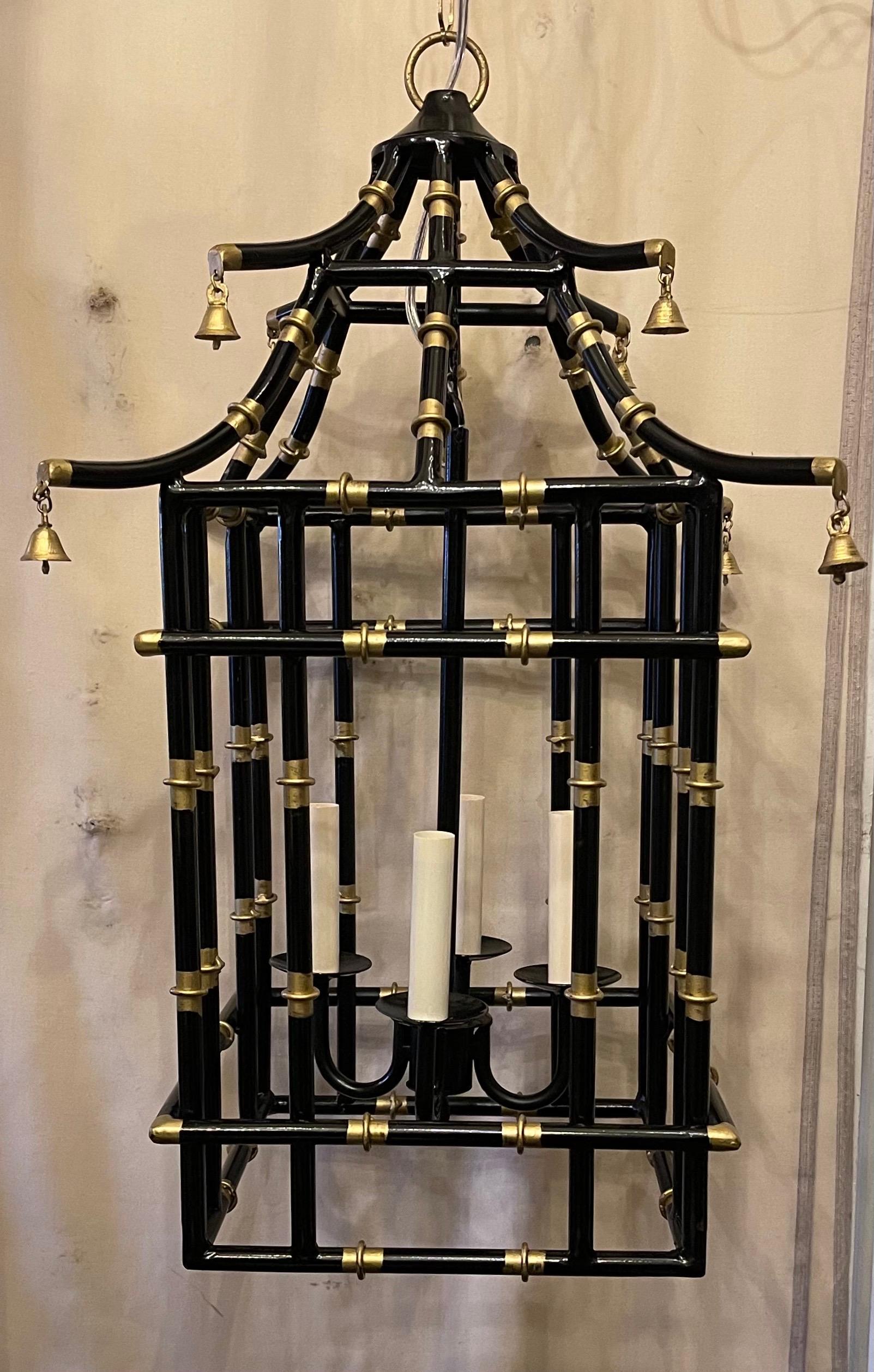 A wonderful medium sized black & gold gilt pagoda bamboo form chinoiserie lantern fixture with 4 candelabra light cluster.
Rewired and ready to install with chain canopy and mounting hardware.

