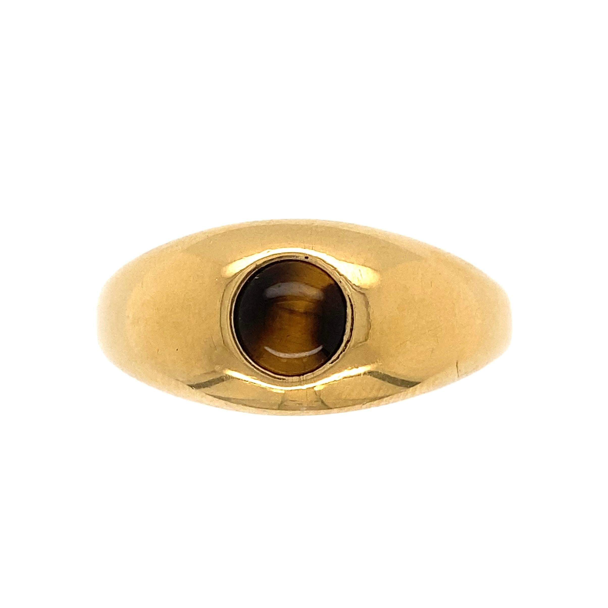 Handsome Fine Quality Gent’s Tiger Eye Gold Signet Ring. Securely set with a Round Tiger Eye, hand crafted 18 Karat Yellow Gold mounting. Ring size 13, we offer ring re-sizing. Dimensions 1.16” x 1.00” x 0.43” h. In excellent condition, recently