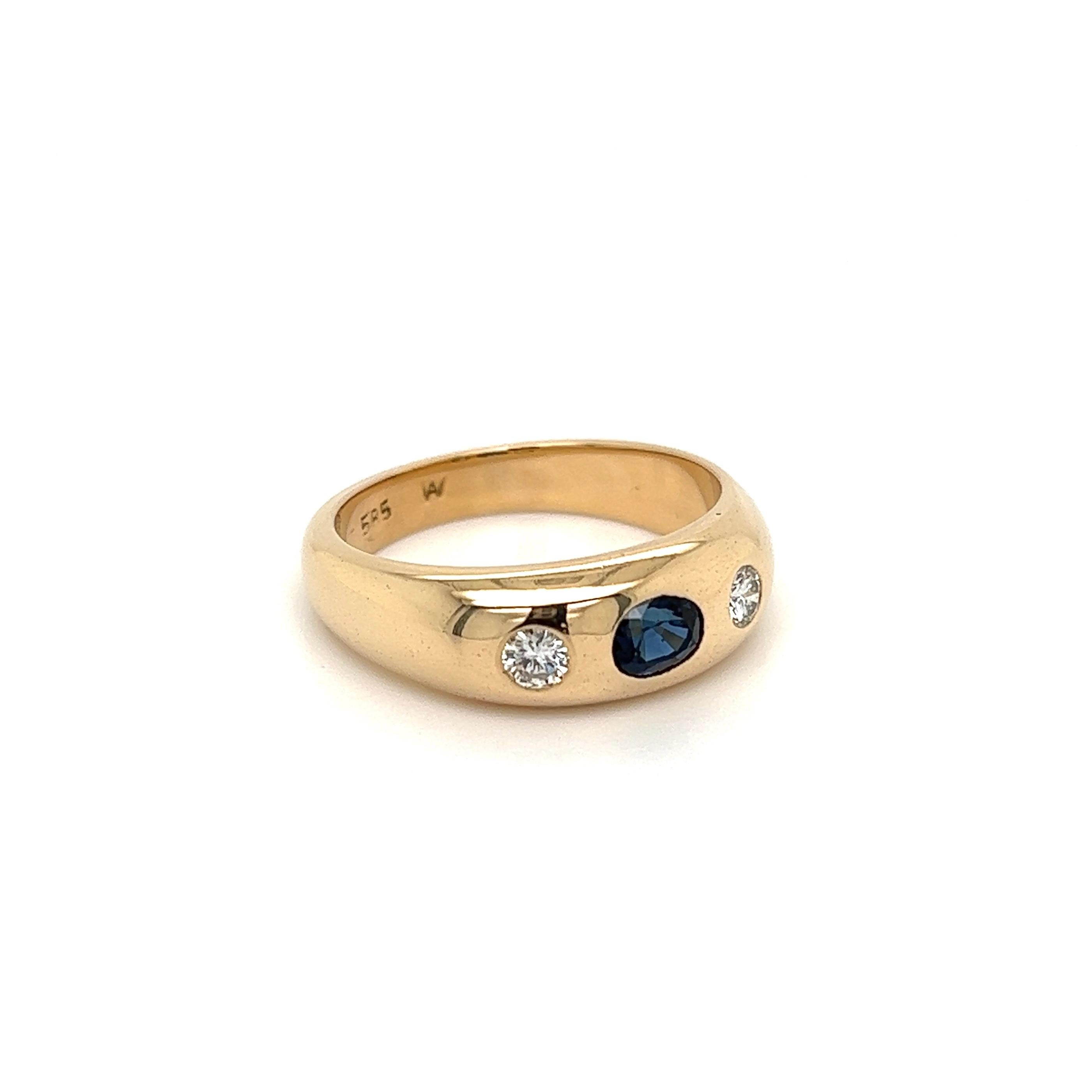Handsome Gent’s Three-Stone Sapphire and Diamond Gold Ring, centering a securely Hand set Oval Sapphire, approx. 0.45 Carat, flanked by Diamonds, approx. 0.25tcw. Hand crafted 14K Yellow Gold mounting. Measuring approx. 0.98”L x 0.84”W x 0.26”H.