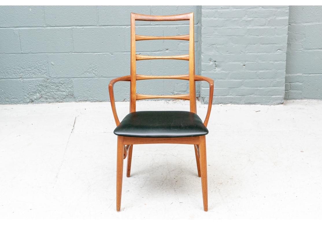 An extraordinary and large Mixed Wood Mid Century group of ten Lis Chairs by Iconic Danish Designer Niels Koefoed. Including two teak arm and eight side chairs (four in teak, four in rosewood). Elegant designed lines with tall narrow shaped ladder