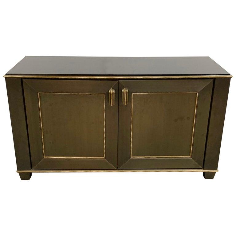 A beautiful statement piece of furniture in the Mid-Century Modern style, bronze and brass ormolu-mounted cabinet retailed by Lorin Marsh in the D&D Building in New York City called the 