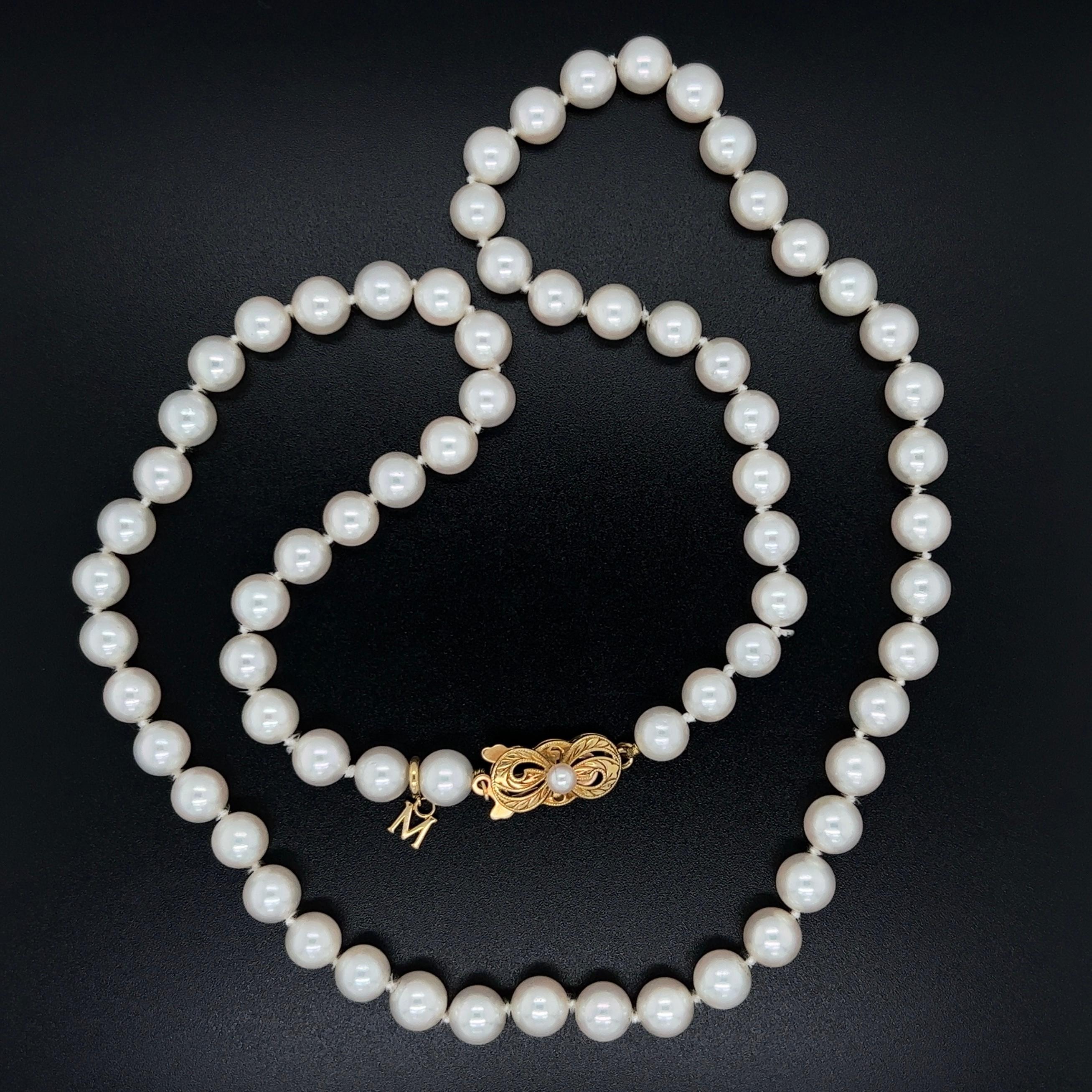 Simply Beautiful! Fine MIKIMOTO Akoya 6.8mm Cultured Pearl Strand Necklace held by a 18K yellow Gold clasp stamped with the famous Mikimoto 