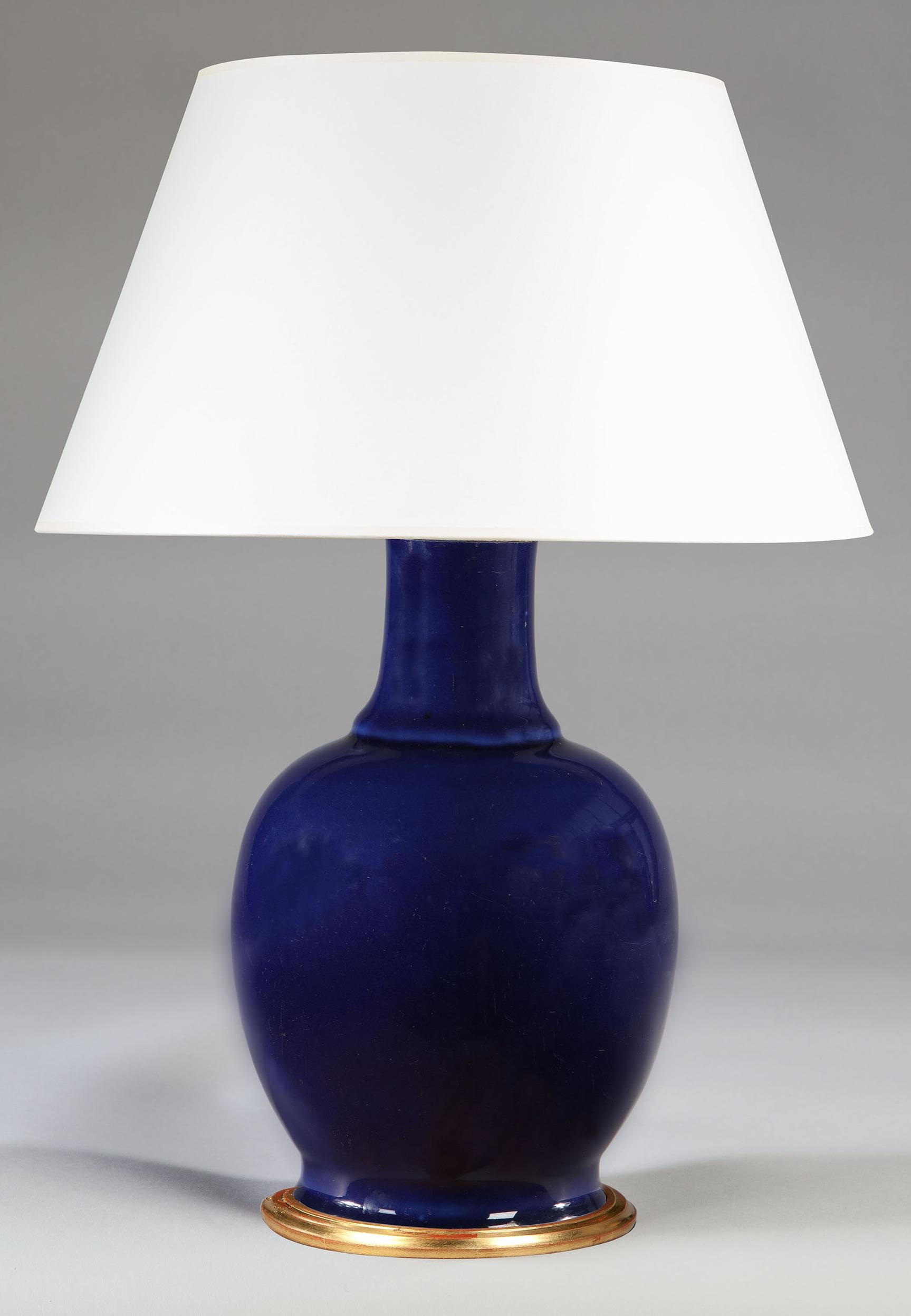 A fine late 19th century vase with a dark blue glaze, now mounted as a lamp.
