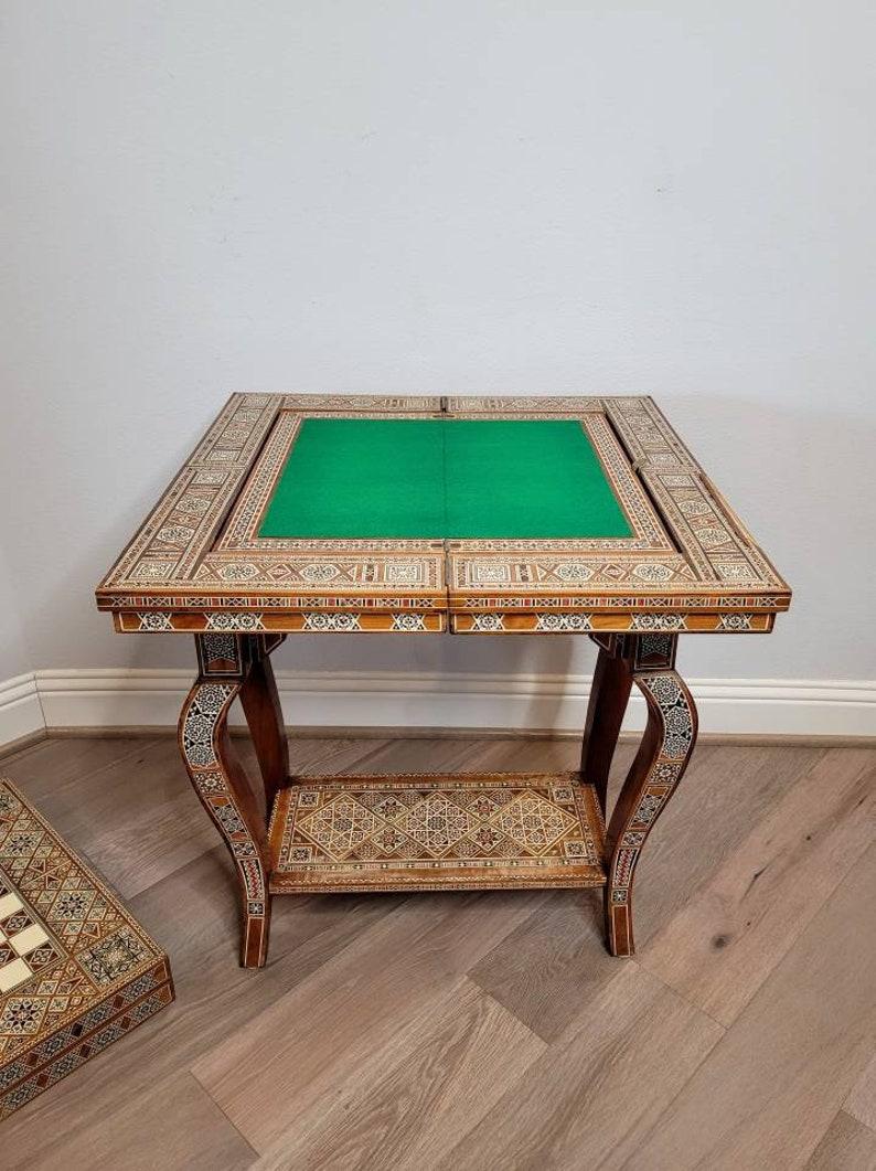 A most impressive vintage Moorish Middle Eastern inlaid gaming table with additional games boards and accessories. Property from the magnificent Estate of Phyllis McGuire.

Outstanding, very rare and hard to find, an exquisite work of functional