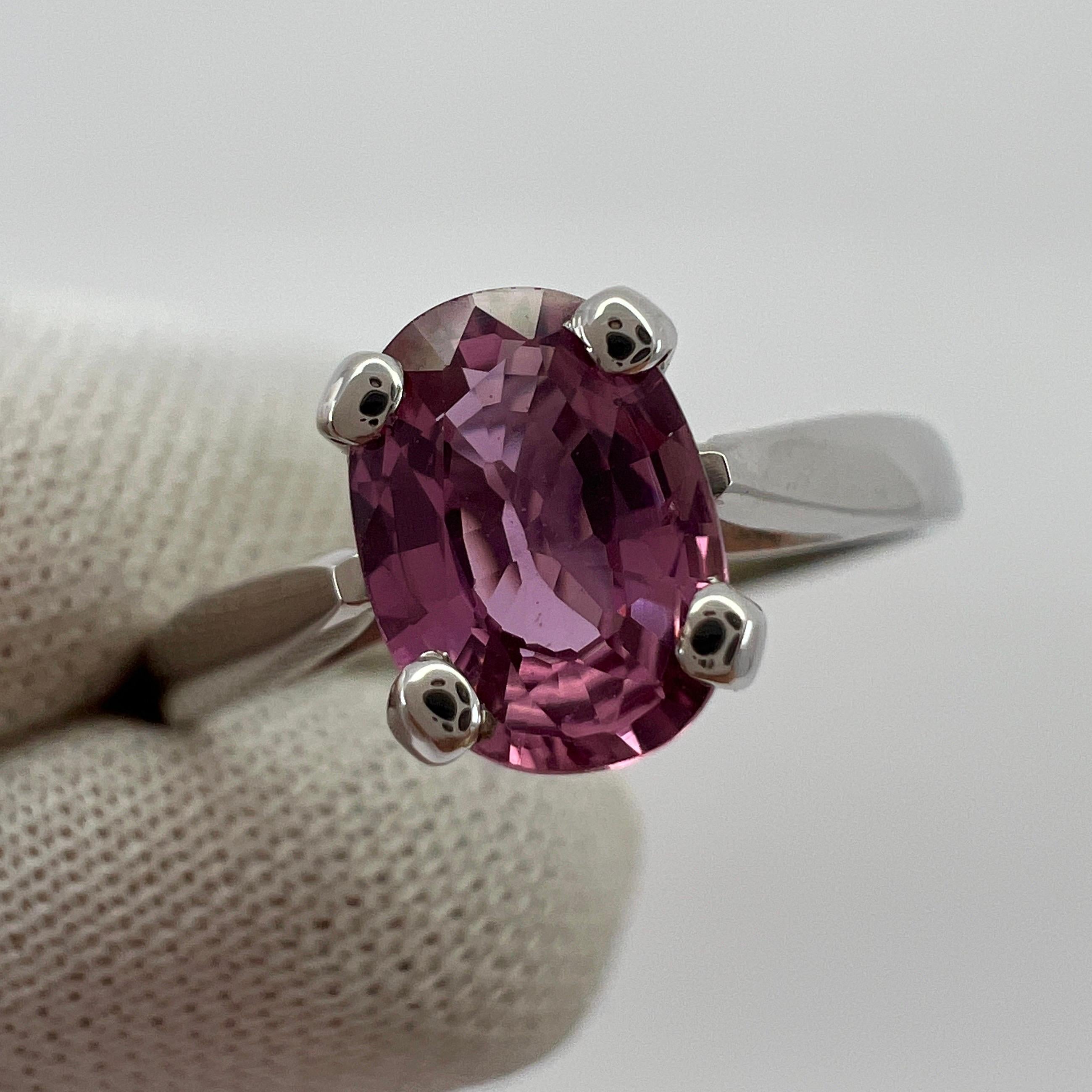 Fine Natural Vivid Pink Sapphire Oval Cut 18k White Gold Solitaire Ring.

Beautiful 1.05 Carat sapphire with a stunning vivid pink colour and excellent clarity. Very clean stone. Also has an excellent oval cut which shows lots of sparkle and light