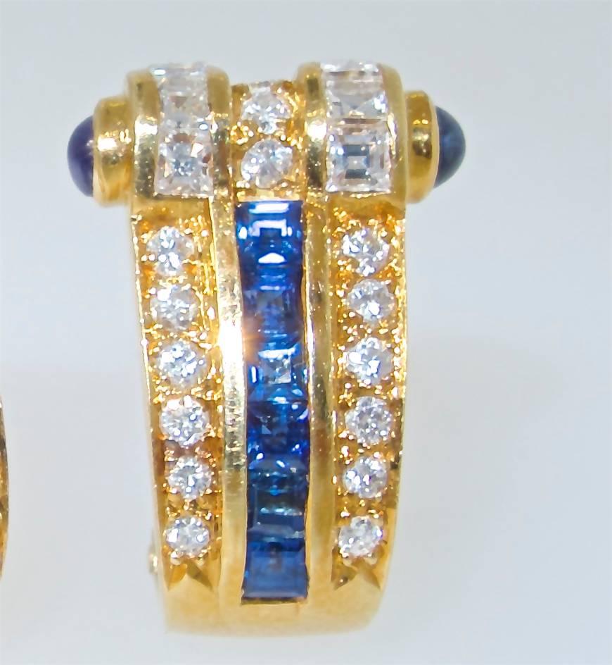 18K yellow gold ear clips with bright blue sapphires and both round and fancy cut diamonds.  The diamonds weigh approximately 1.42 cts., and the sapphires weigh .80 cts.  There are 30 round brilliant cut diamonds,  and 12 square cut diamonds - all