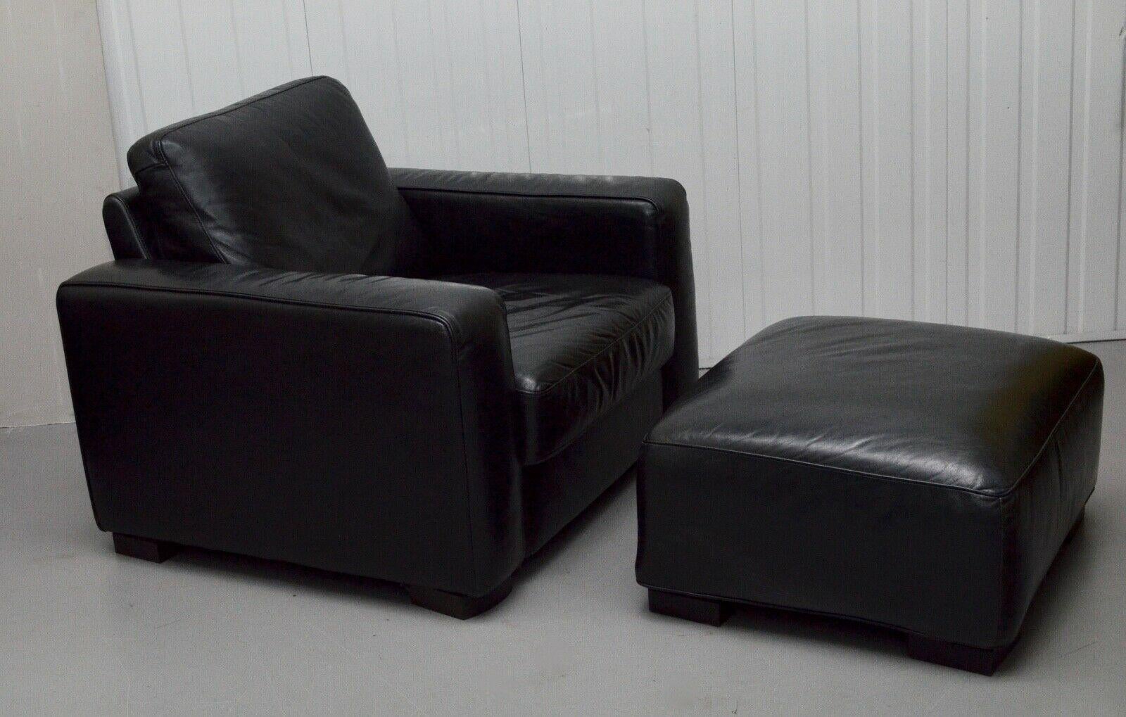 We are delighted to offer for sale this contemporary Natuzzi black leather armchair with a matching footstool. Full of stylish details it is made from high-quality full-grain Italian leather and a hardwood frame. The armchair and footstool are very