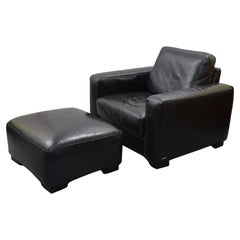 FINE NATUZZI BLACK LEATHER ARMCHAiR & FOOTSTOOL MADE IN ITALY