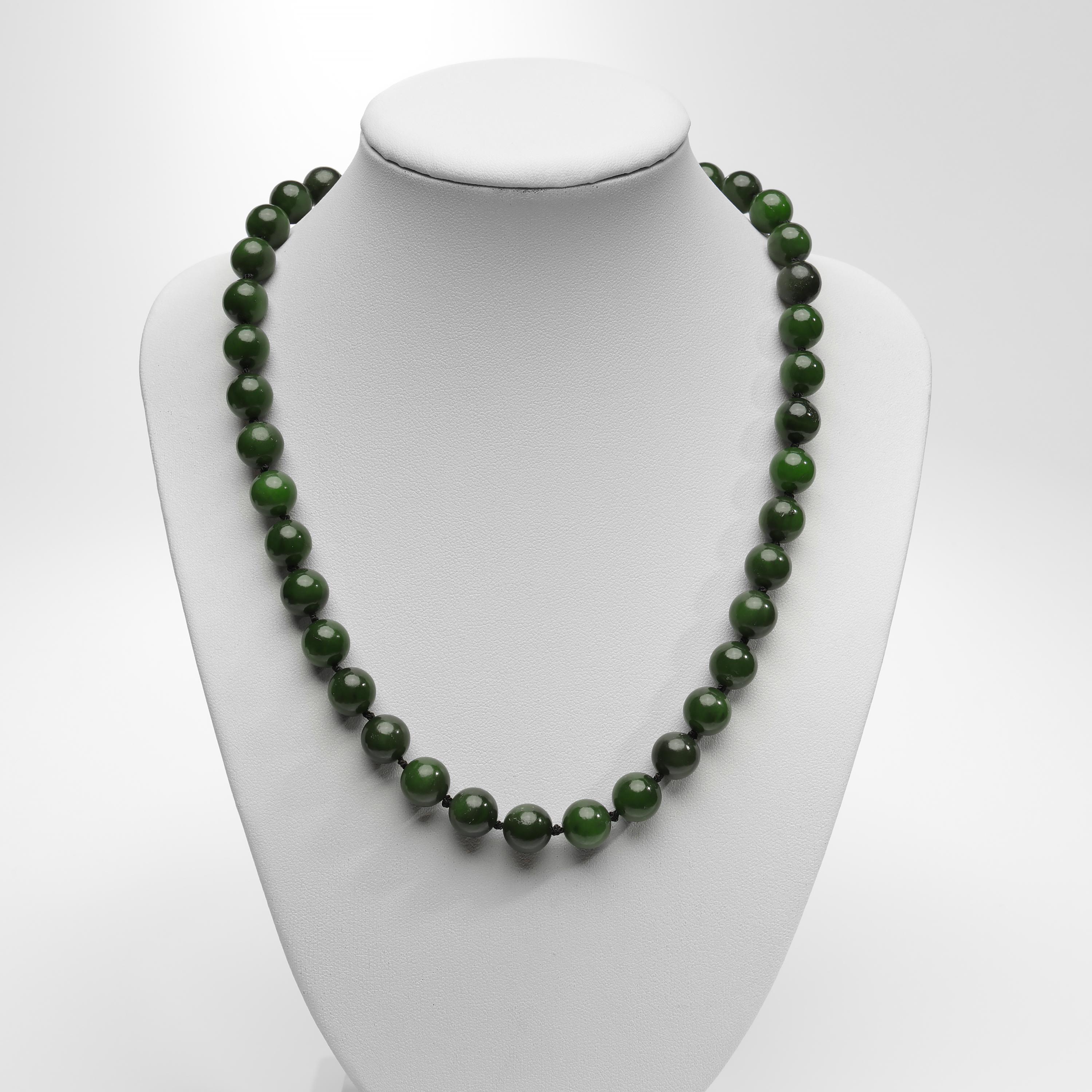 40 luminous and translucent deep forest green nephrite jade beads are simply —perfectly— presented in this stunning 18