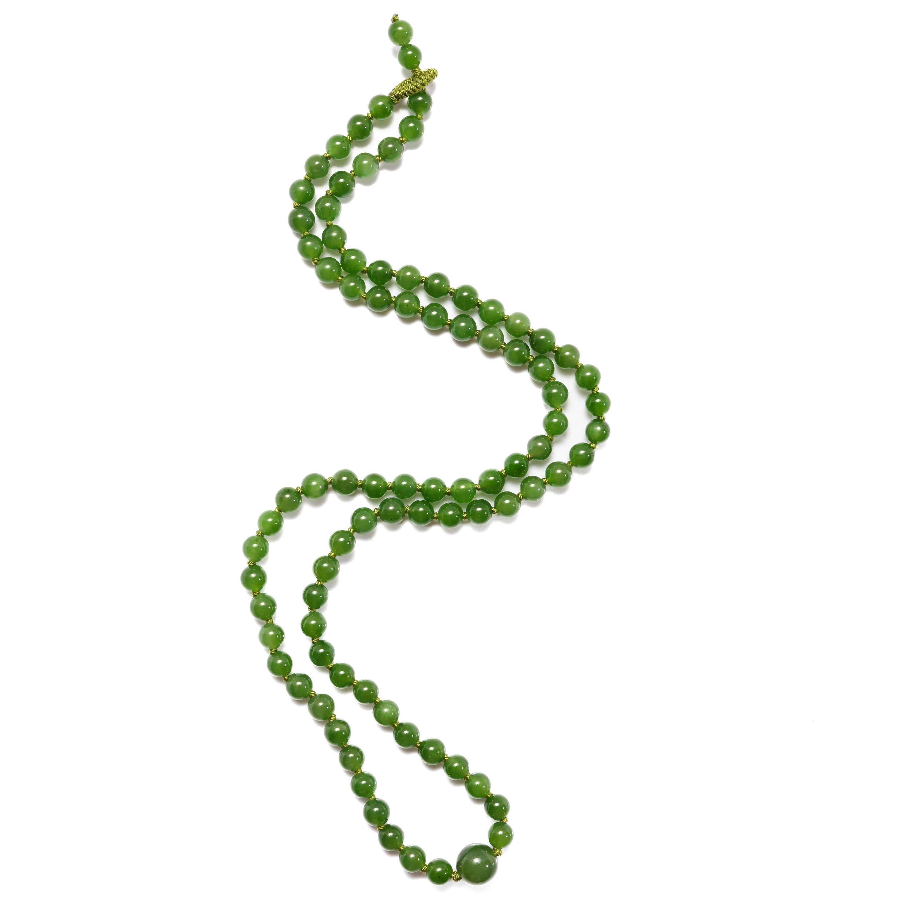 This is a brand new, handmade necklace created from very fine, highly translucent nephrite jade beads. Featuring a unique 