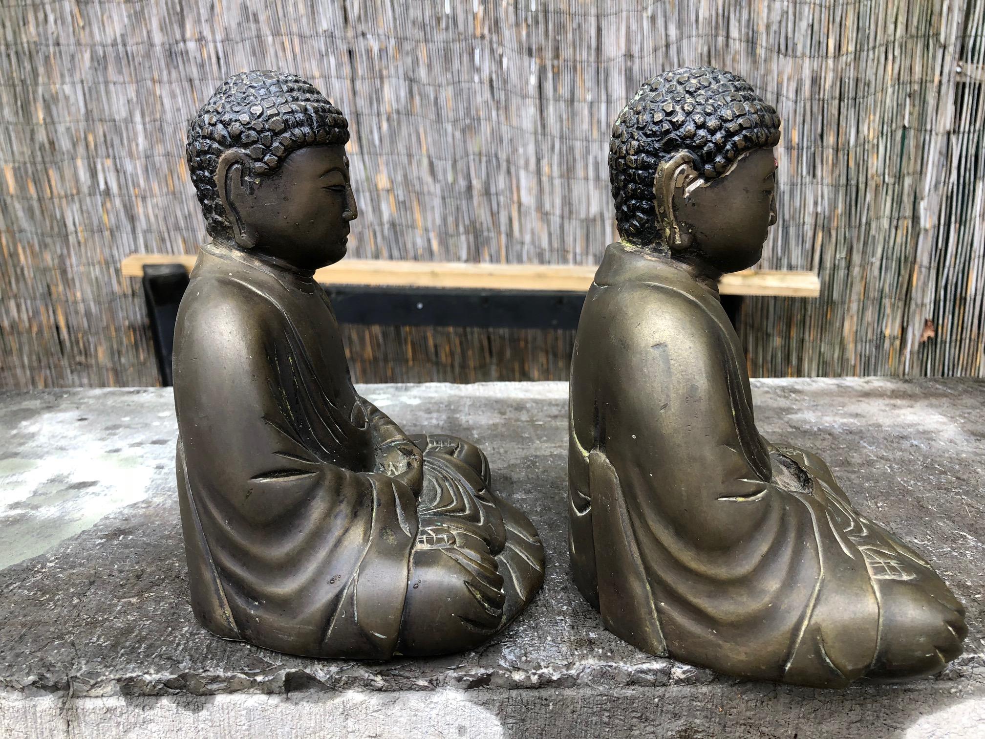 Japan, a fine near pair of old seated Buddhas, hand cast bronze with a Fine medium to dark brown patina performing the mudra of meditation or cosmic mudra.

These beautiful Buddha sculptures will bring serenity and timeless style to your home,