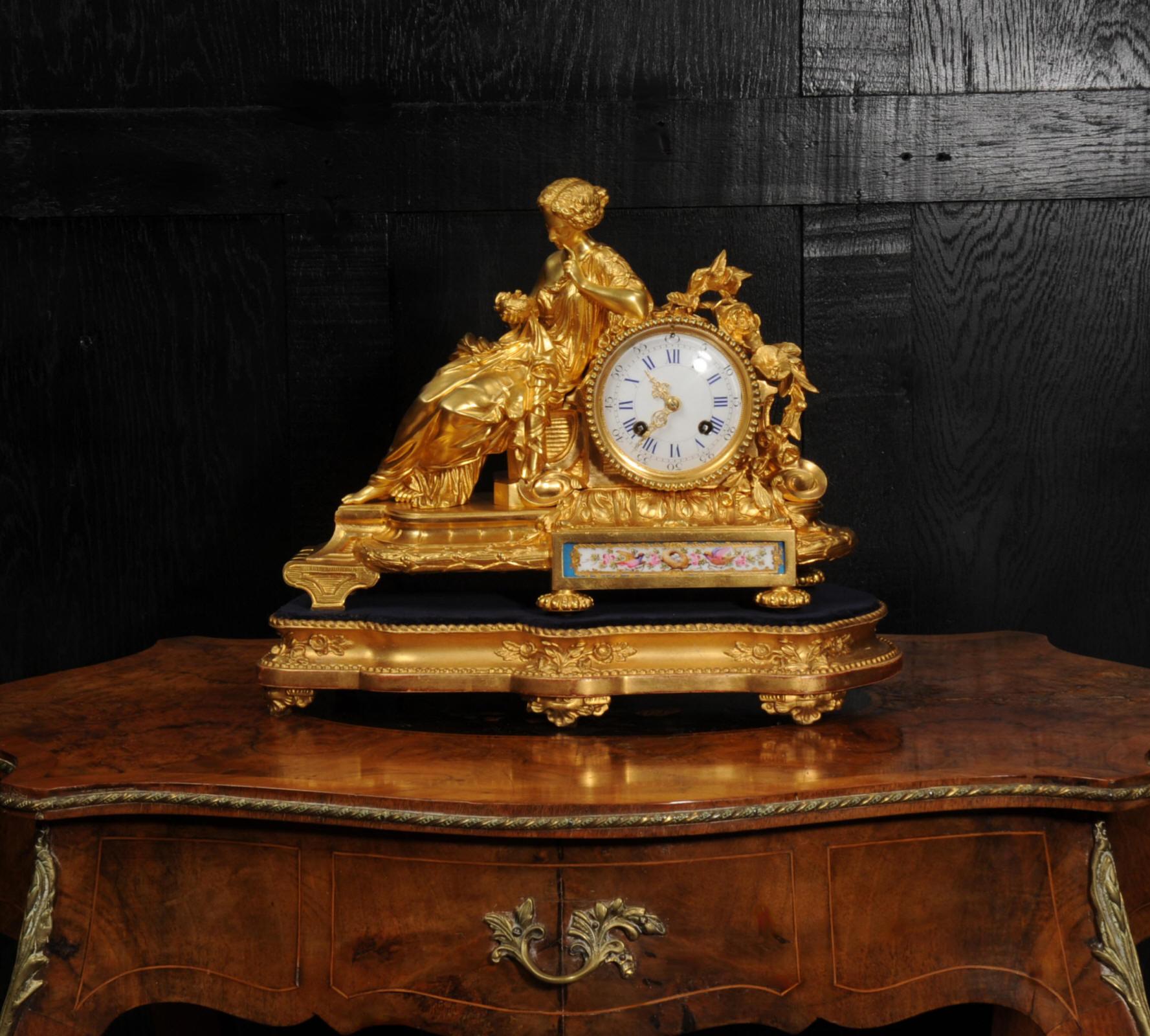A fine and early Ormolu and Sèvres style porcelain clock by the famous case maker and retailer Rollin of Paris and the movement by Japy Frères. It is exquisitely modelled in finely gilded bronze, showcasing the finest quality. The intricate folds