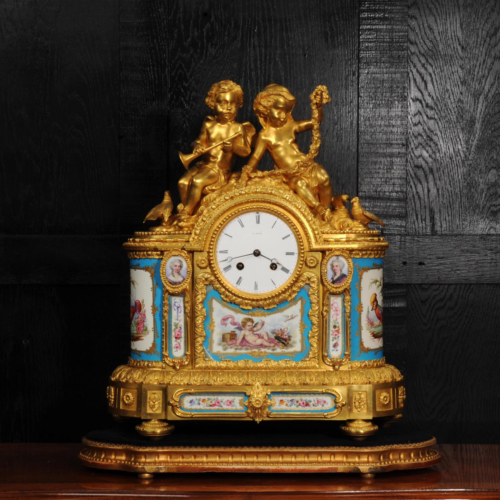 A superb, large and early Ormolu clock, mounted with exquisite Sèvres style porcelain with a Bleu Celeste ground and fine overglaze gilt decoration. The richly chased foliate case is formed of mercury fire gilded Bronze Doré, to the top, beautifully