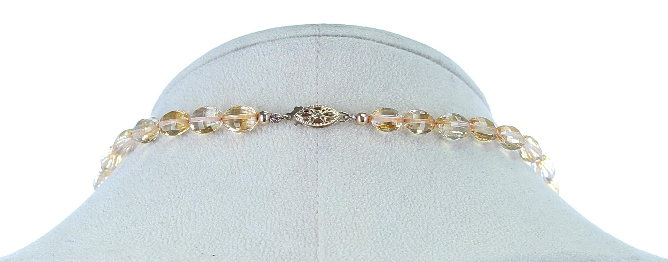 A fine strand of oval and faceted Citrine beads weighing 135 carats, Length: 17 inches. 14K Yellow Gold Clasp.