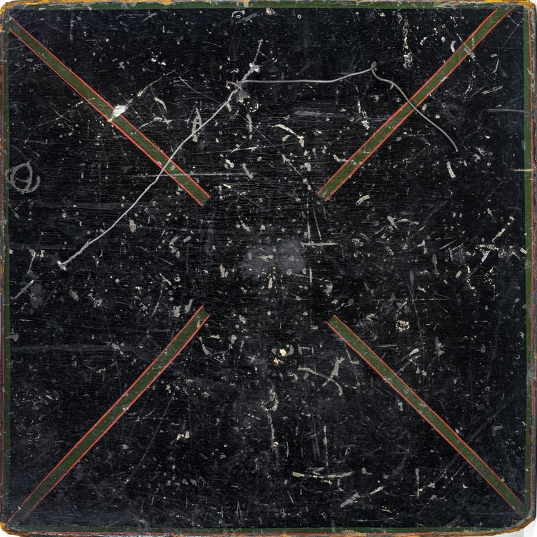 Double sided painted game board with
a red, black, yellow and green checkerboard on one side
and a “X” painted game board on the reverse
side, American, circa 1900. Measures: 16” x 16”.
 