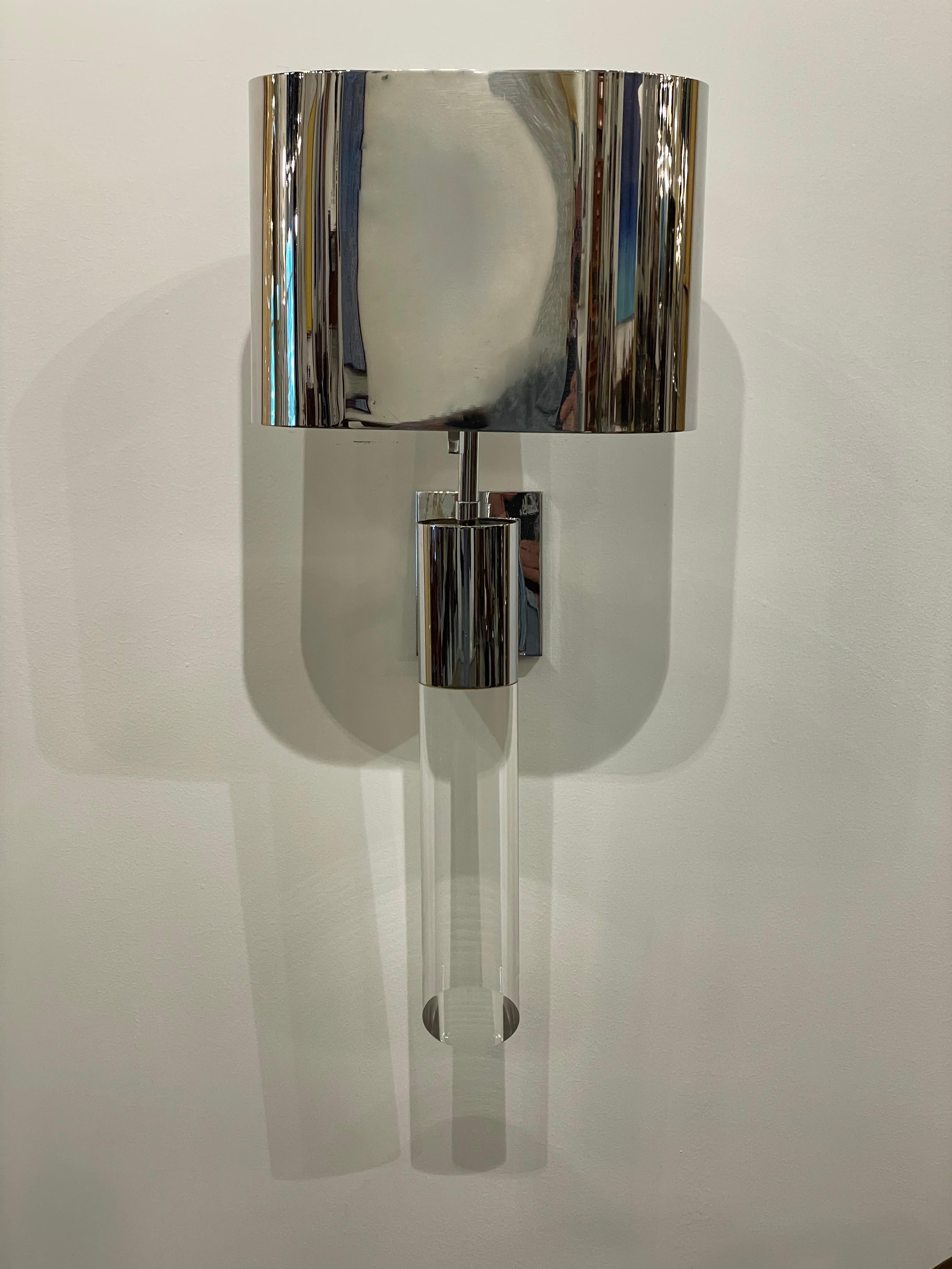 The rectangular polished steel shades with rounded corners above a light source, mounted with a polished steel back plate, and chunky steel and lucite stem, formerly property of the estate of Zsa Zsa Gabor.