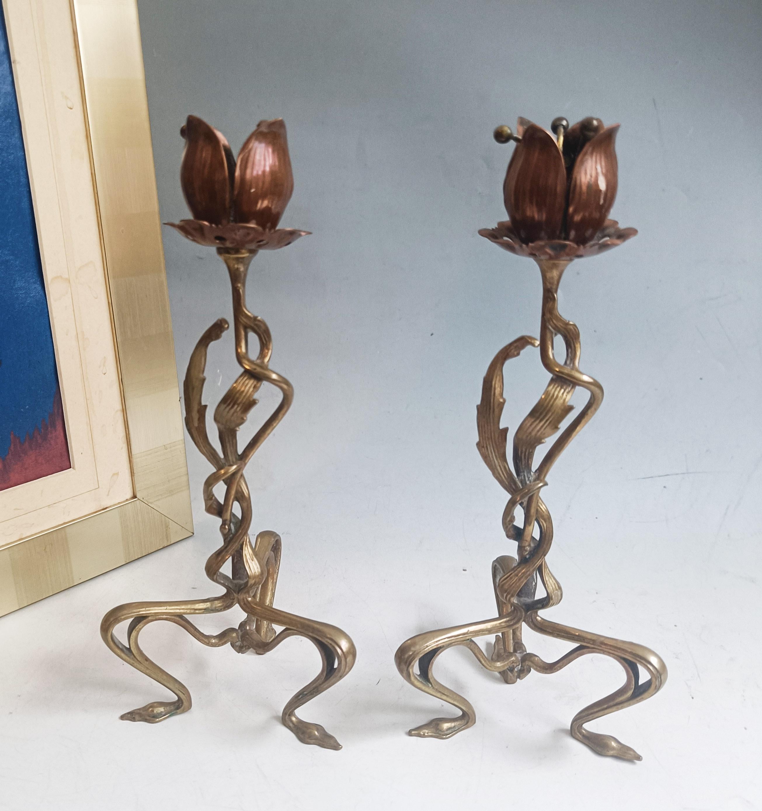 Fine Pair of French Art Nouveau Candlestick Holders, c.1900

A fabulous pair of Art Nouveau candlestick holders dating to around 1900, beautifully crafted with the flowing organic lines that define the period. Each candlestick features sinuous,