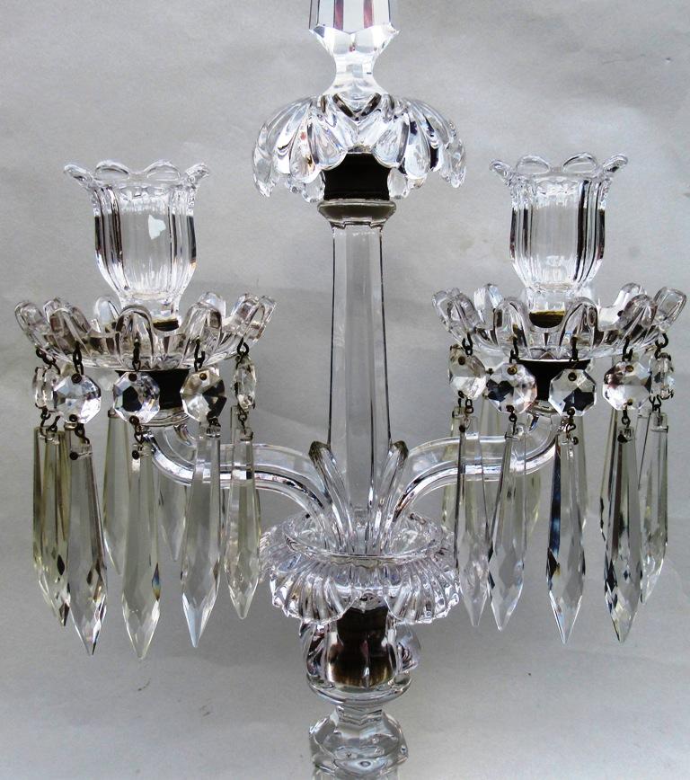 An exceptionally fine pair of French unmarked baccarat full led crystal twin light table or mantle candelabra of larger proportions.

Made during the last half of the 19th century.

Each baluster knopped standard issuing a scroll arm ending in